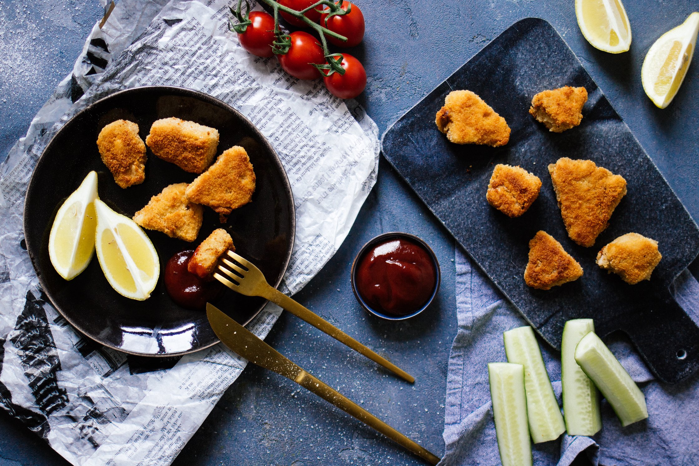 nuggets with bbq sauce on a blue backdrop