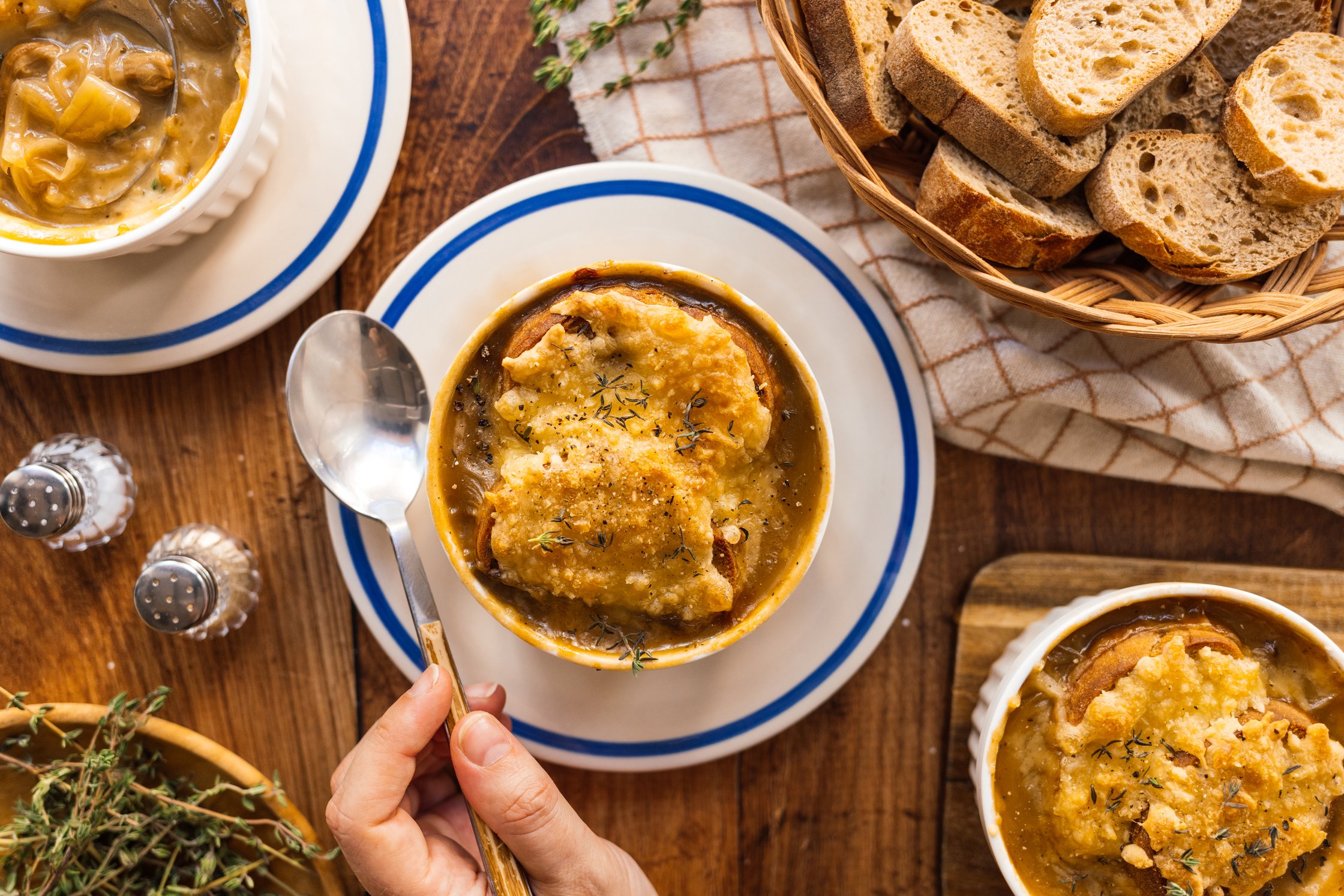 Vegan French Onion Soup with Mushrooms served on the table