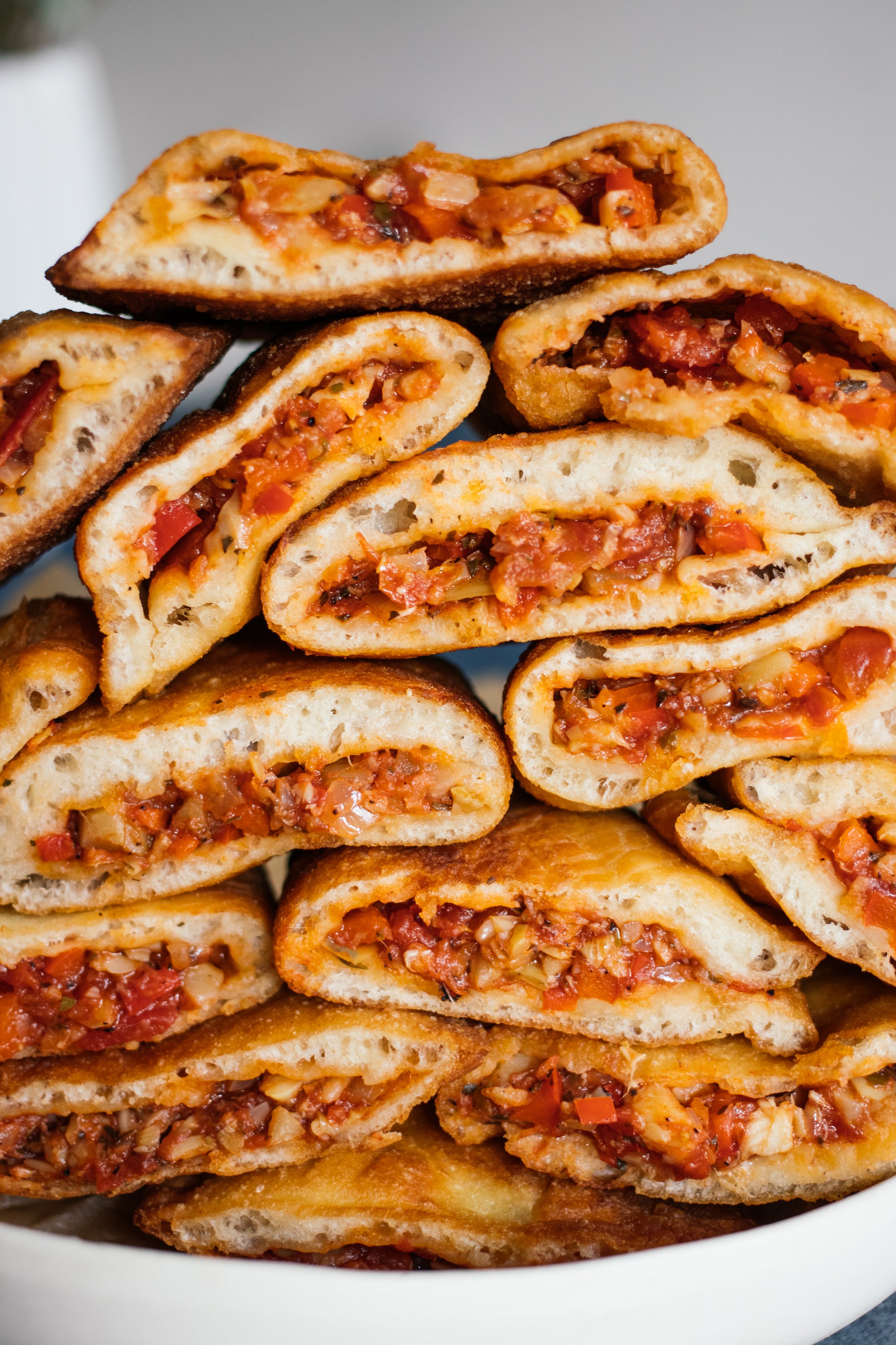stack of vegan panzerotti cut open