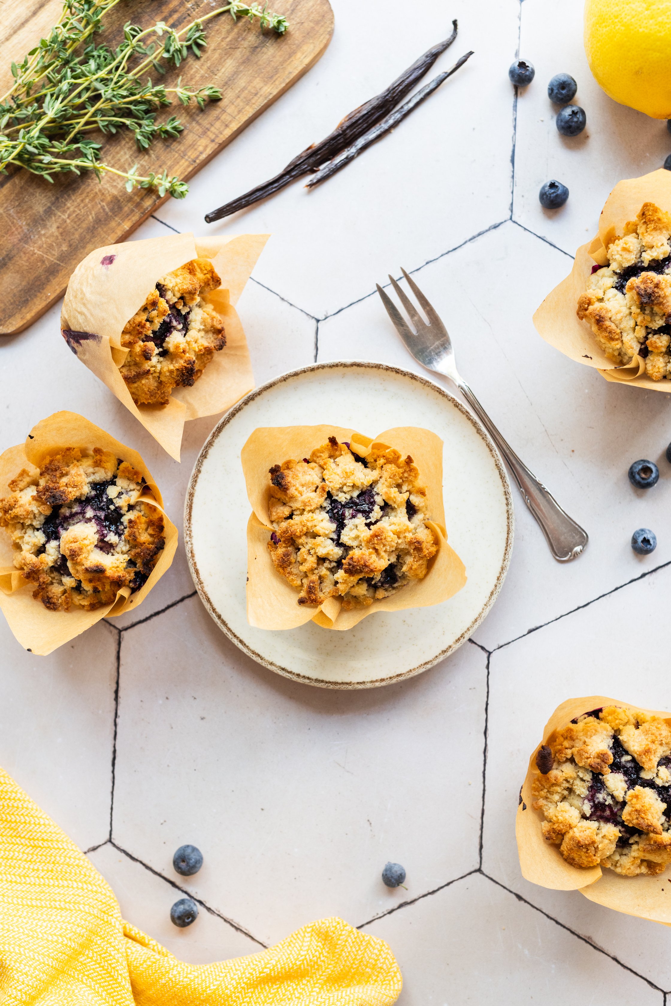 Here a muffin is arranged on a plate.