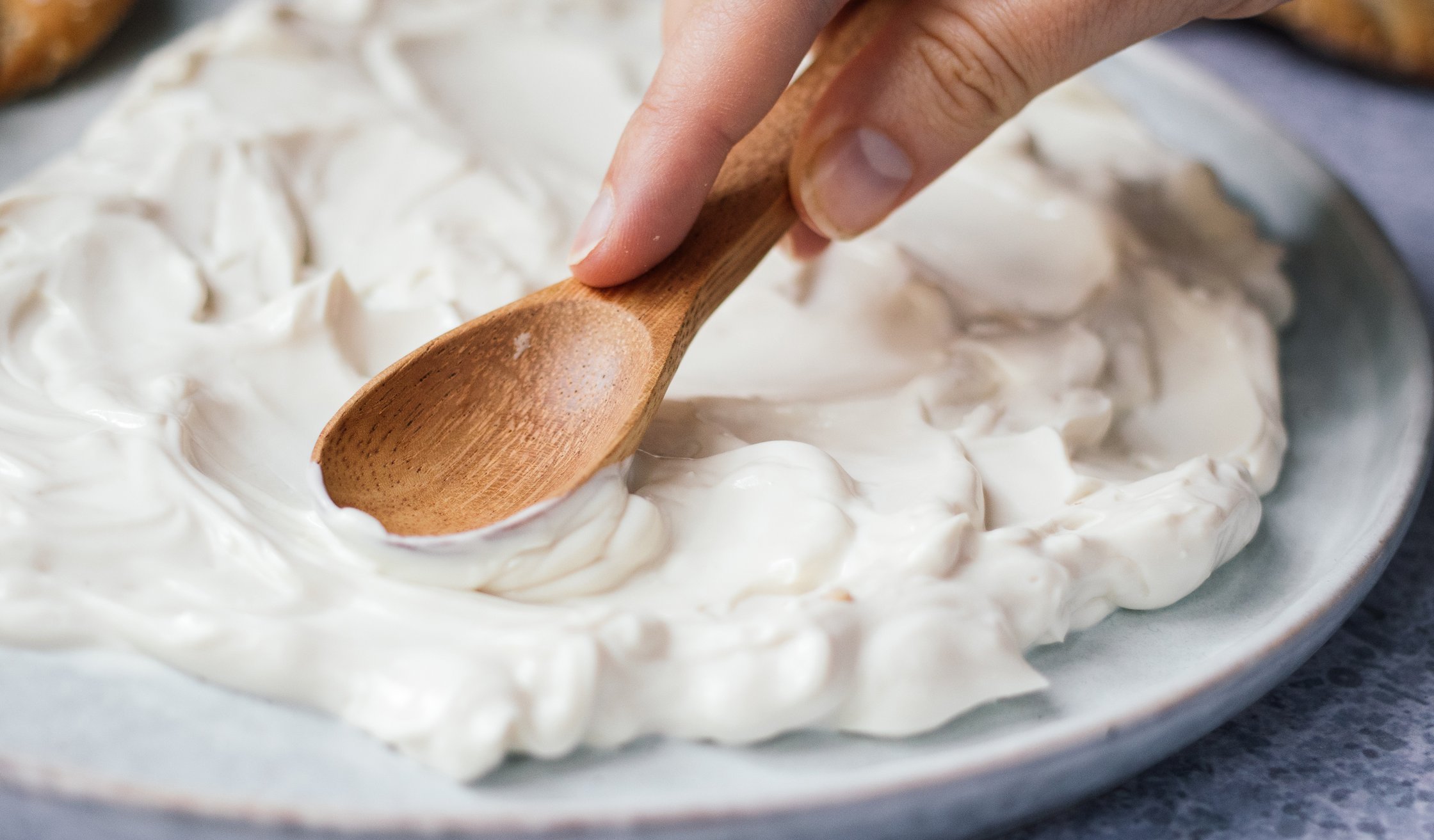 spreading vegan labneh on a plate