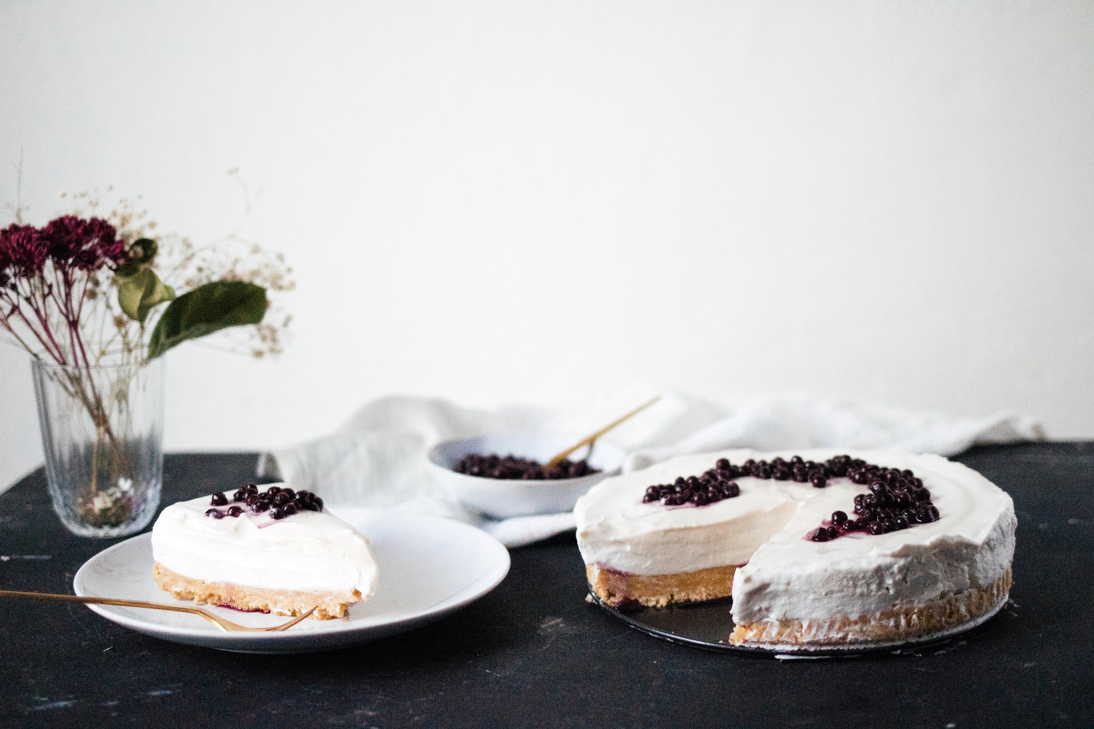 vegan New York Cheesecake on a black background