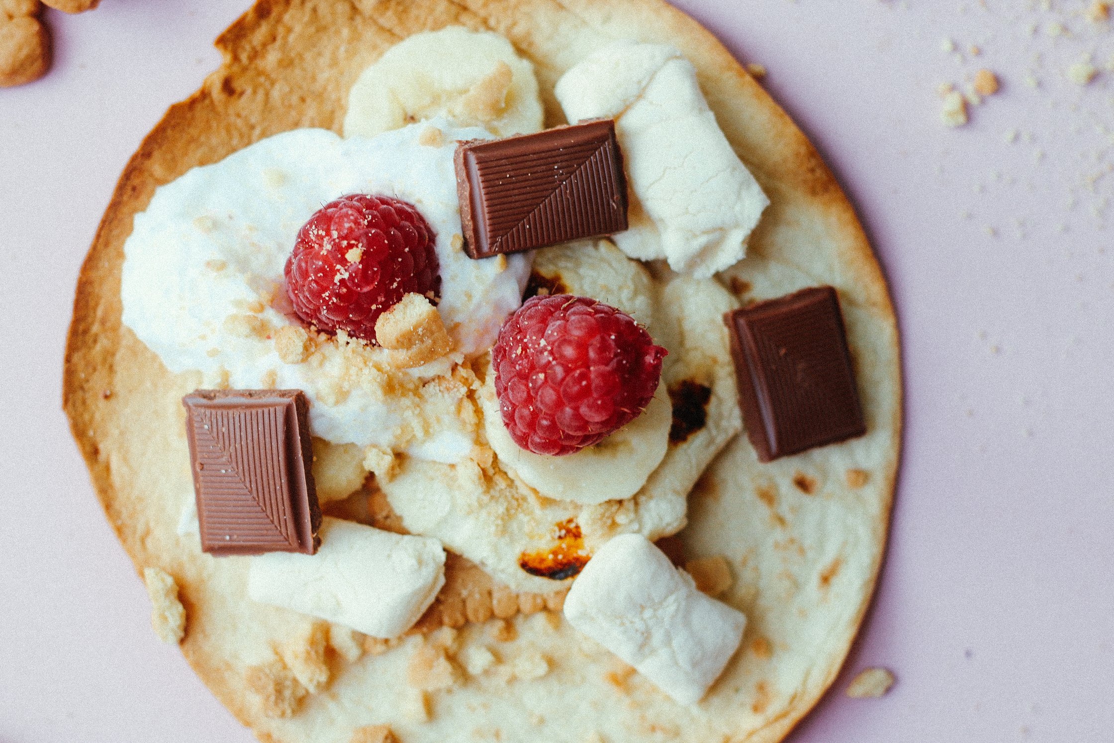 Taco topped with raspberrys