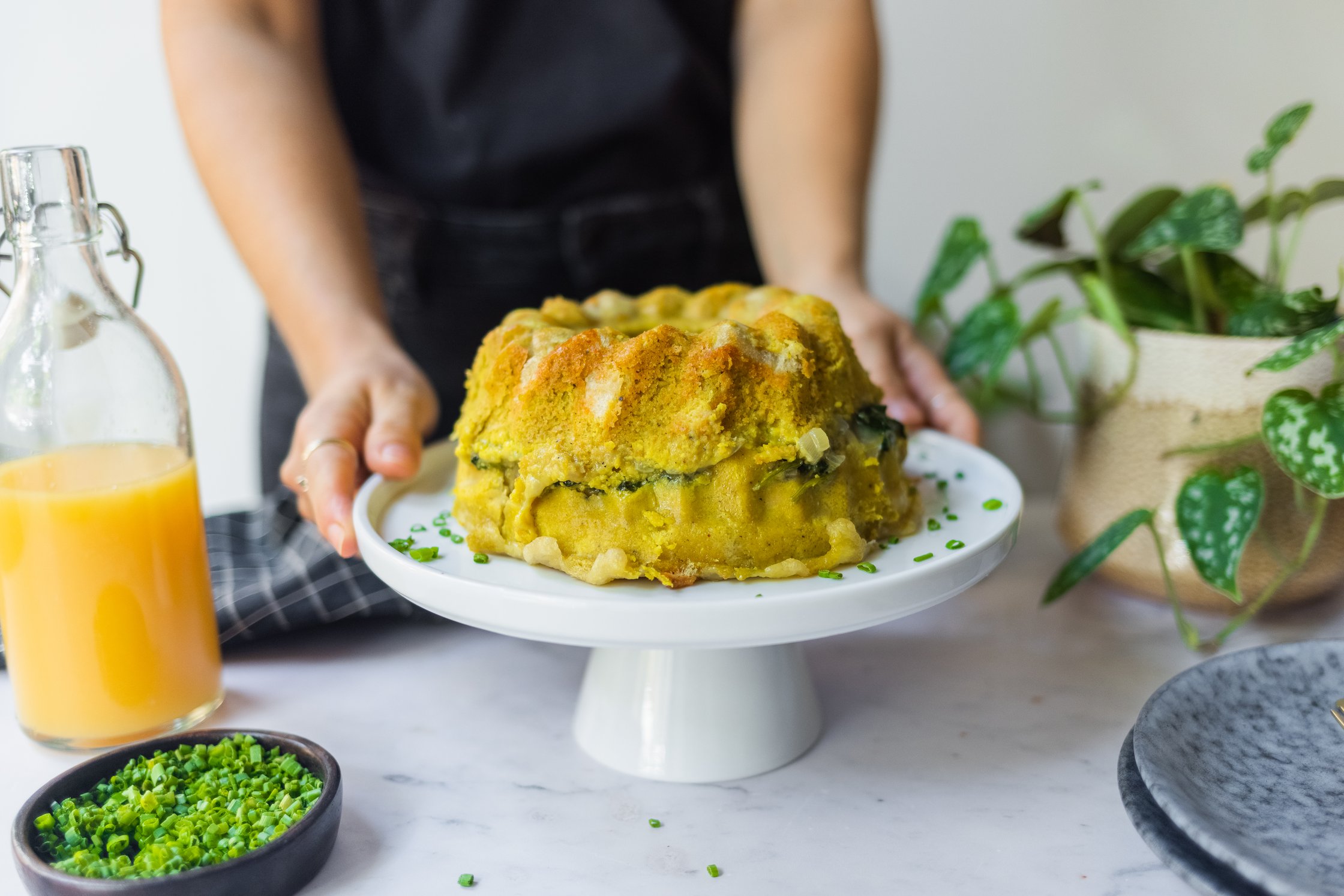 sliced bundt cake filled with vegan cheese, vegan baloney, spinach and toast