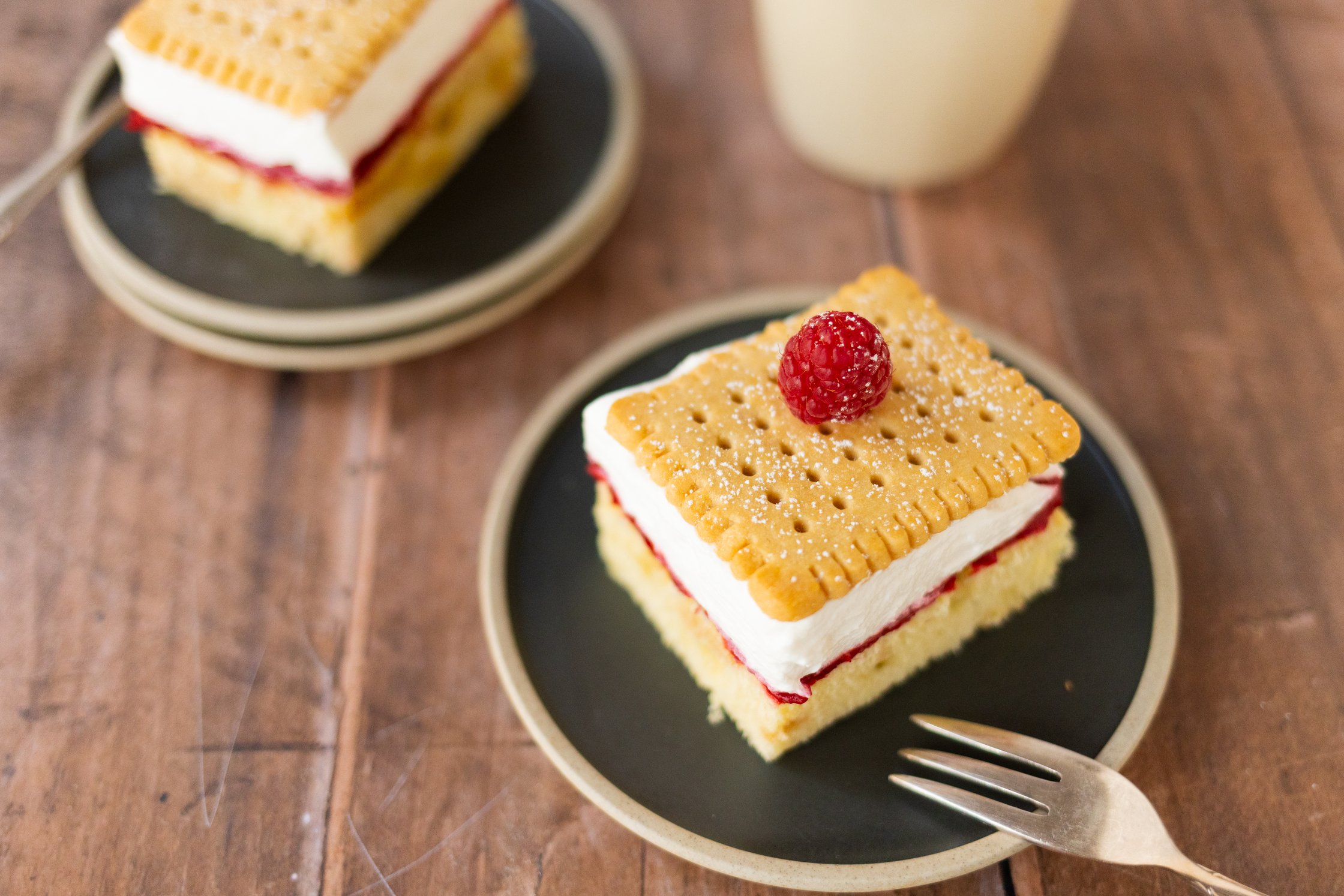 a piece of raspberry shortbread cake on a small plate