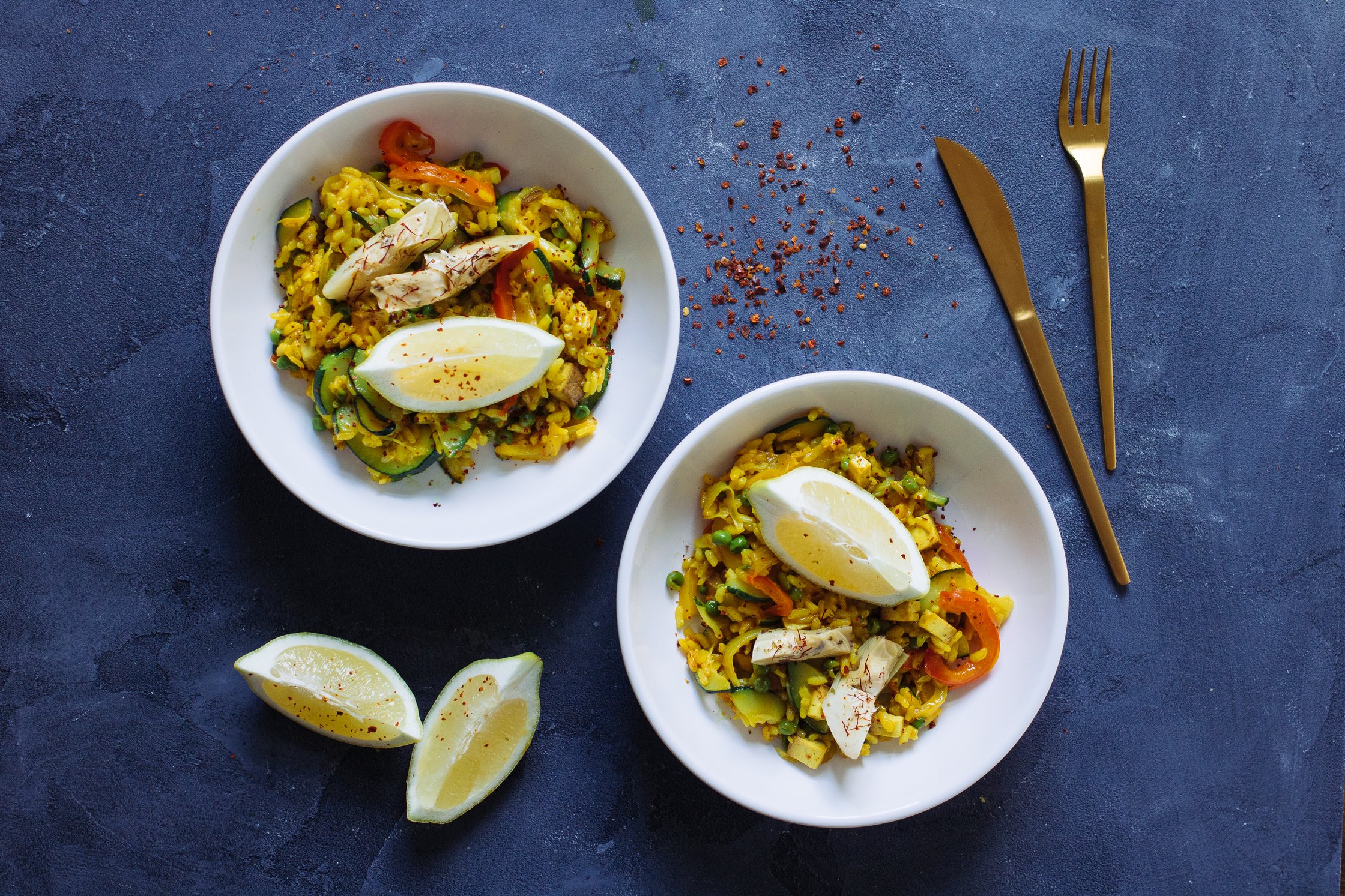 two bowls filled with paella
