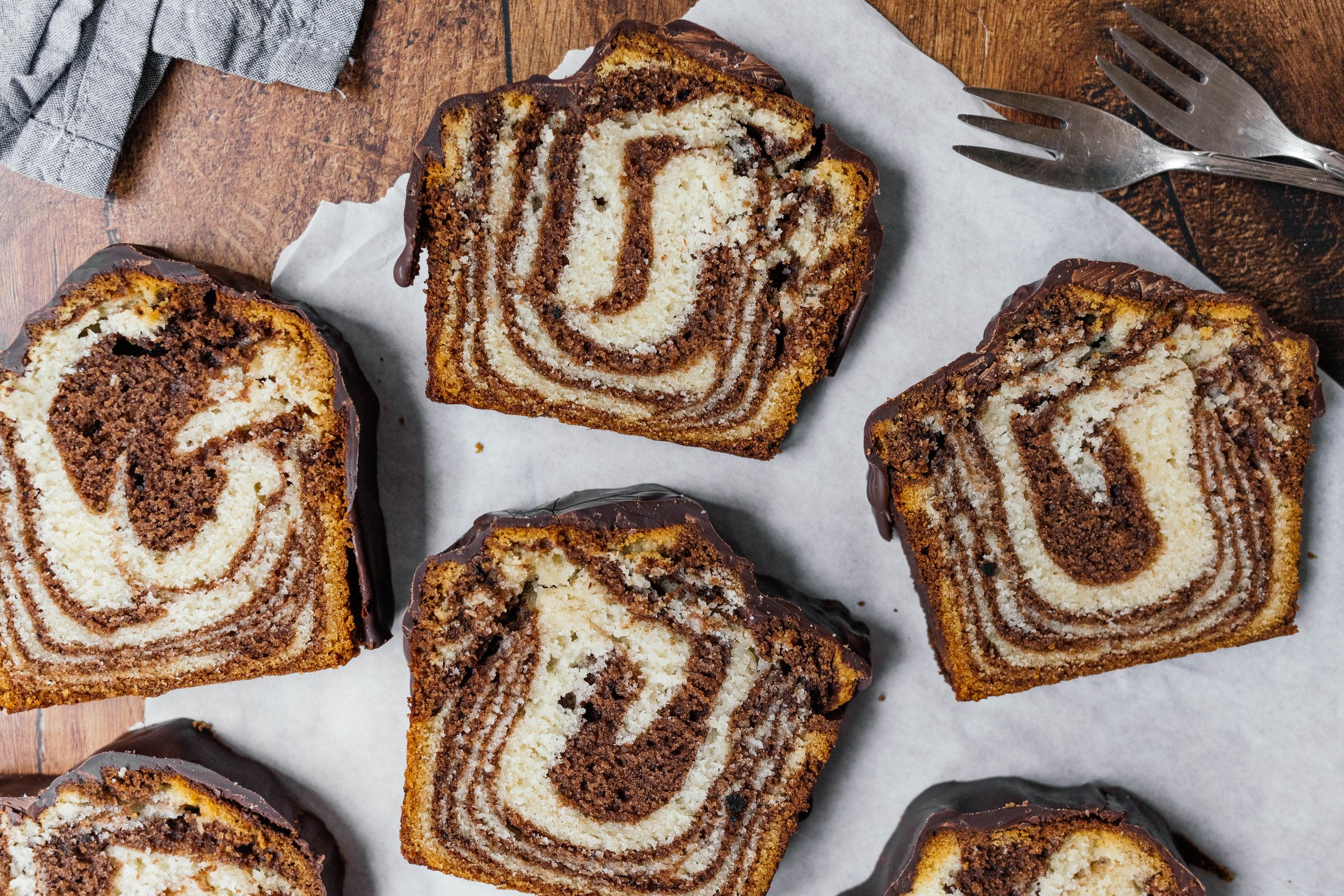 slices of vegan marble cake with chocolate glaze