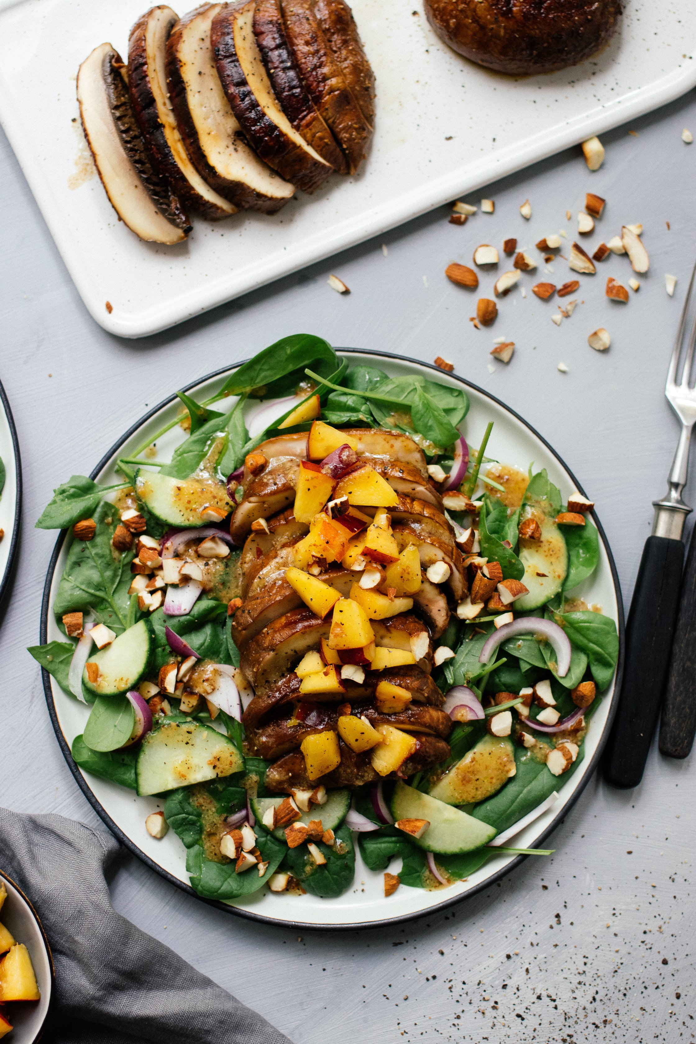 upright photo: salad on a plate, topped with almonds