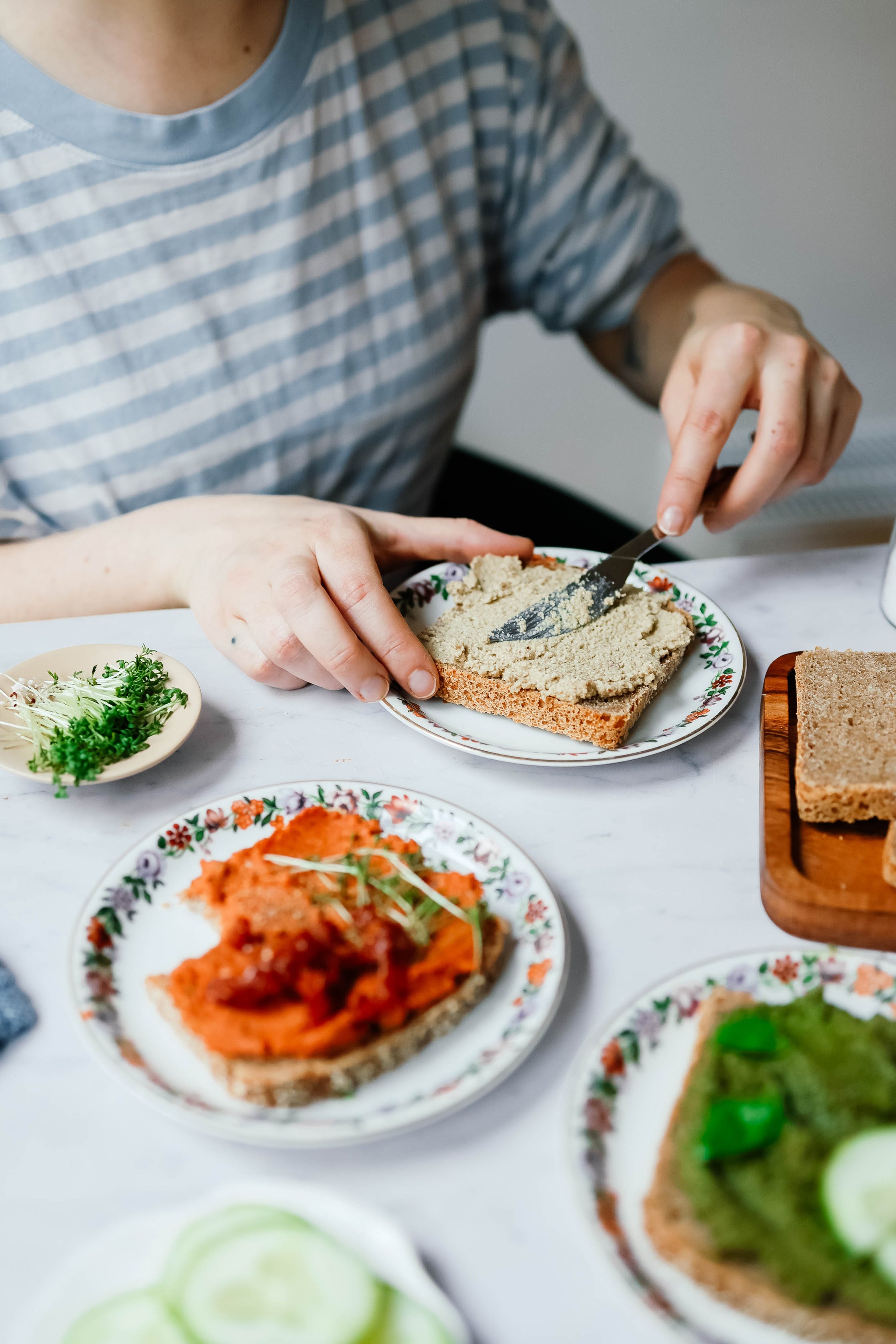 slices of bread with vegan spread made of sunflower seeds in three different flavors