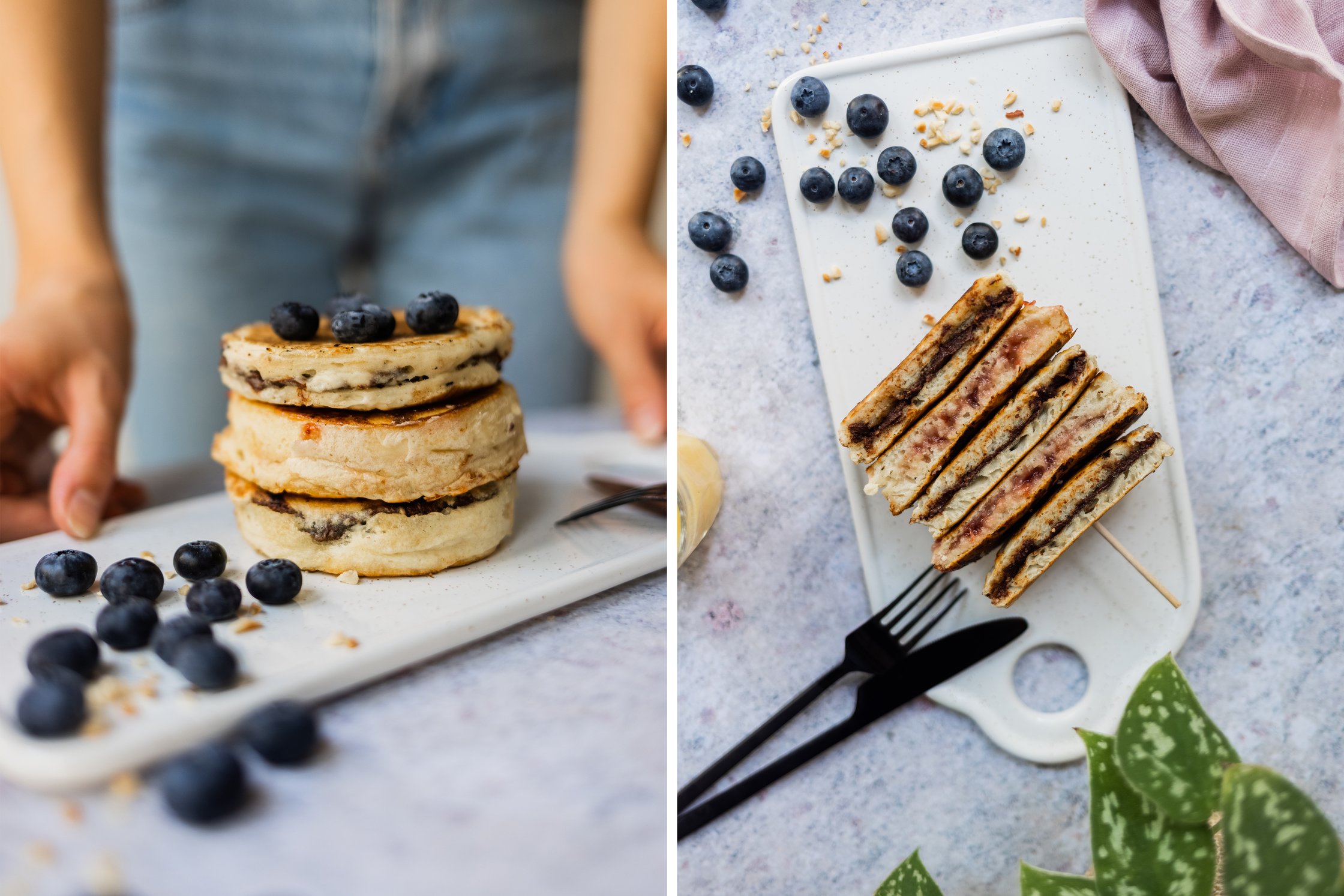 filled pancakes stacked, with blueberries and chopped hazelnuts decorated on a small board