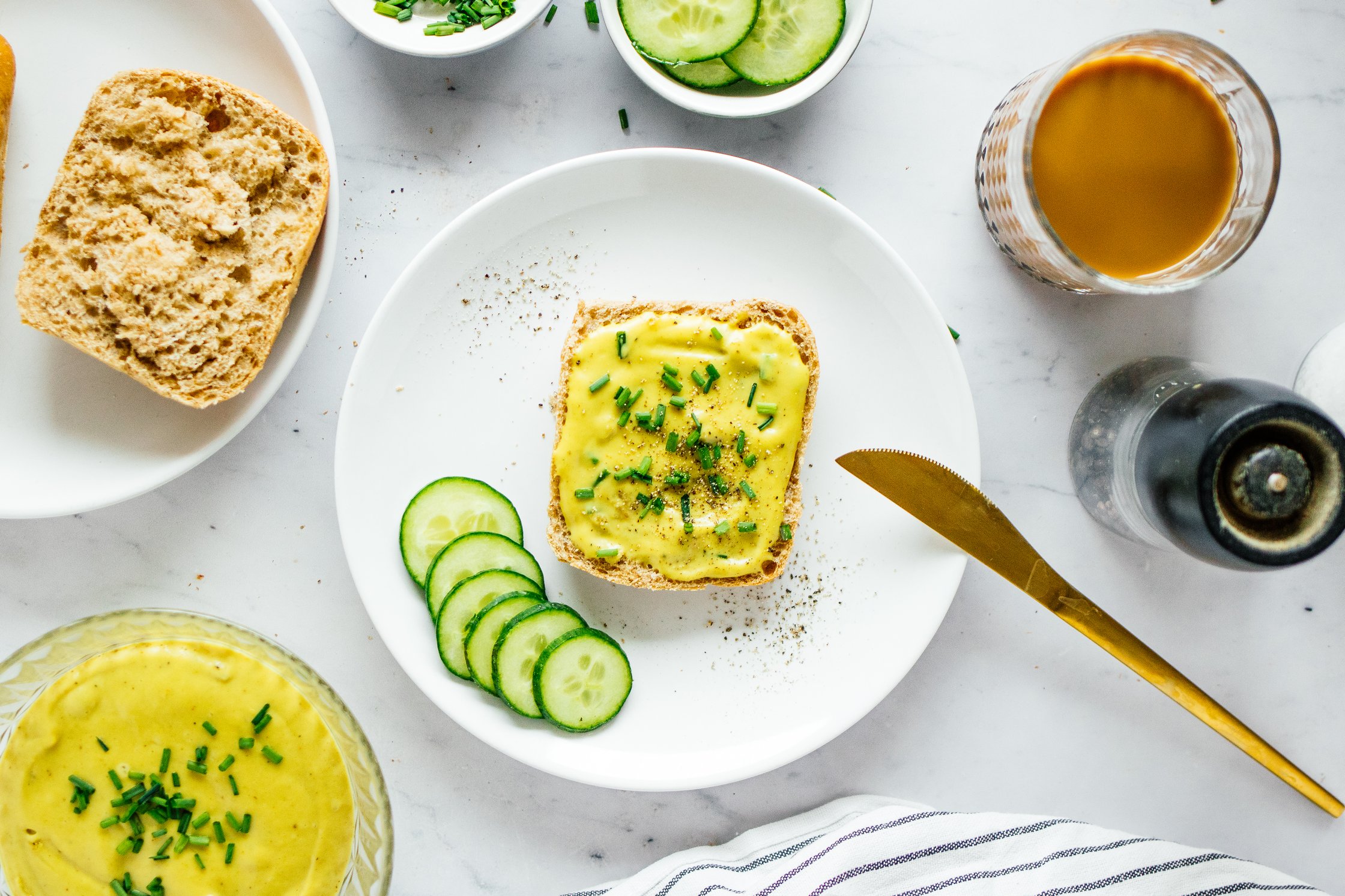 a bread roll with vegan cheese spread