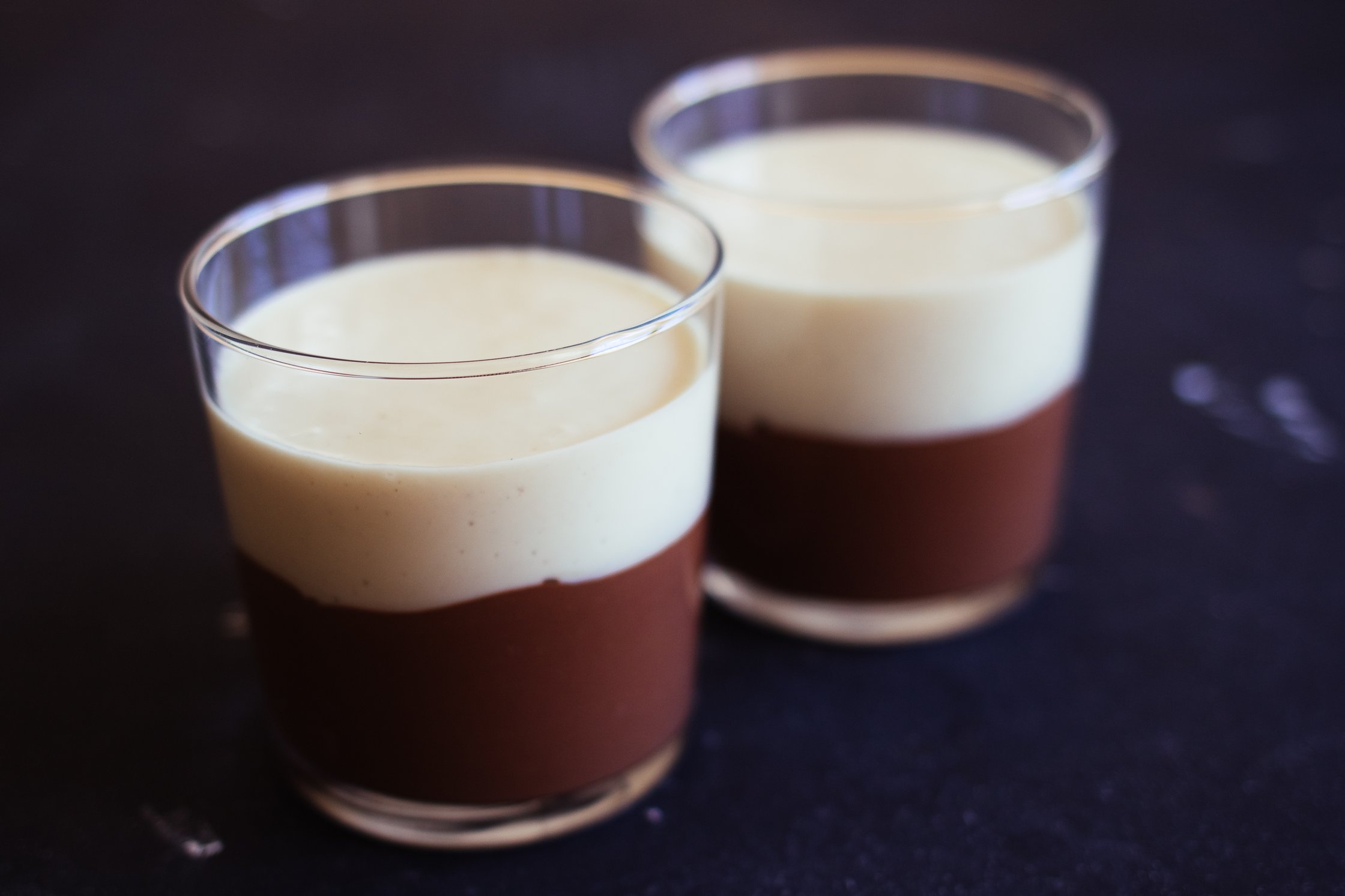 white and dark vegan chocolate mousse in a jar