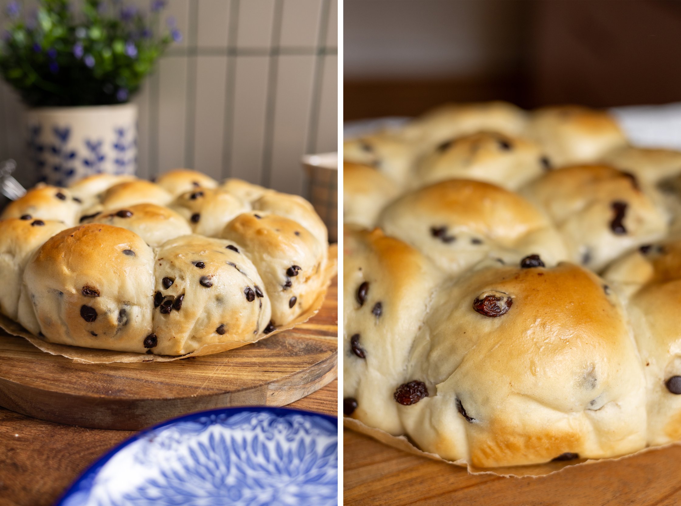 Vegan milk rolls with raisins on wooden board beside blue-white plate