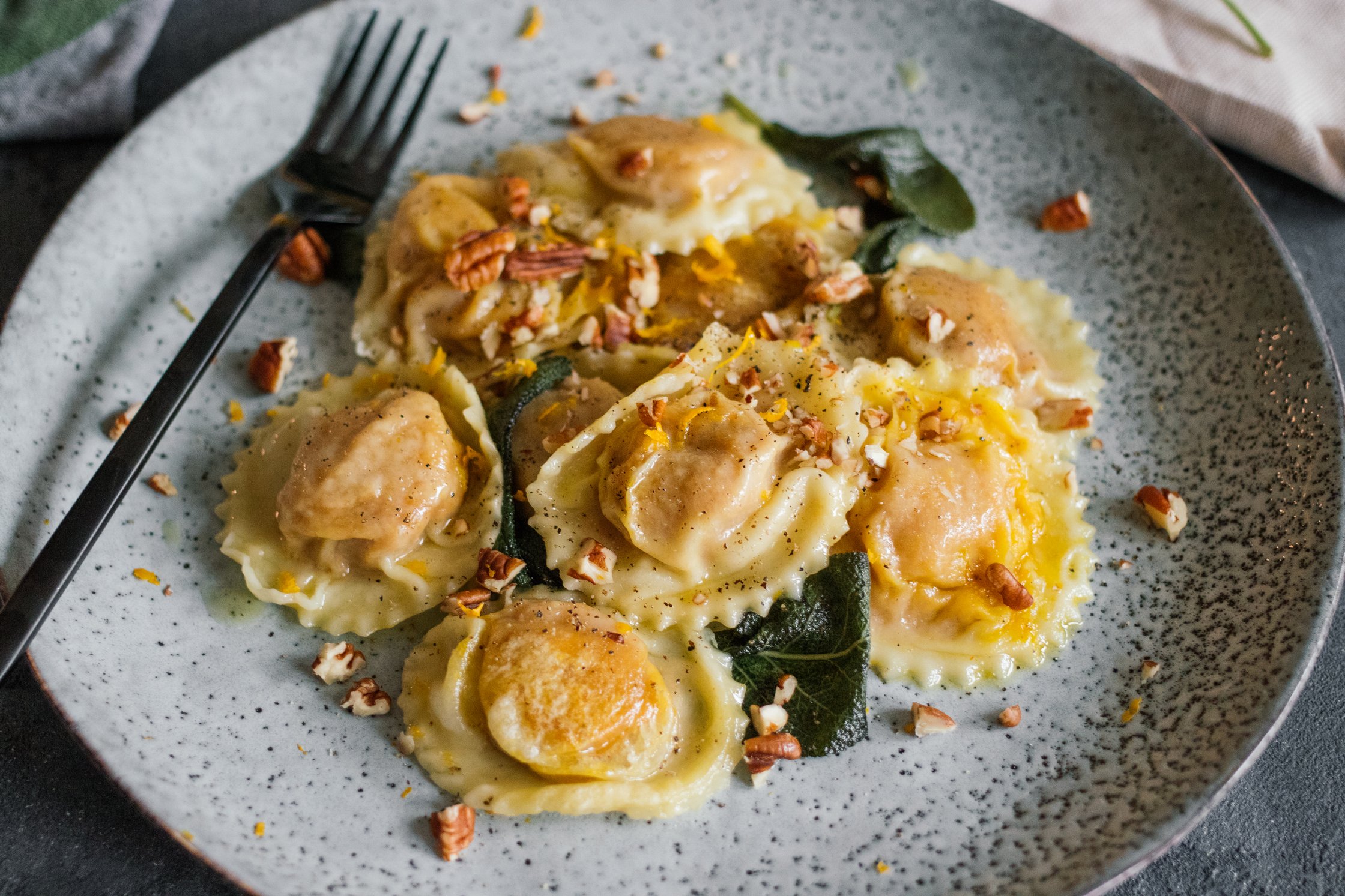 vegan Pumpkin Ravioli in Sage Butter served