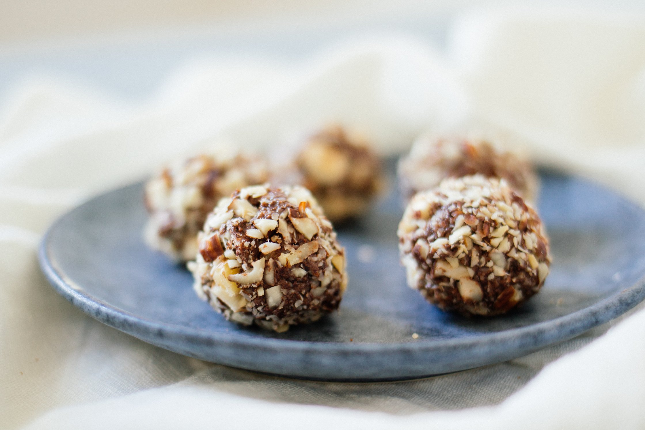 vegan rocher on small, blue plates