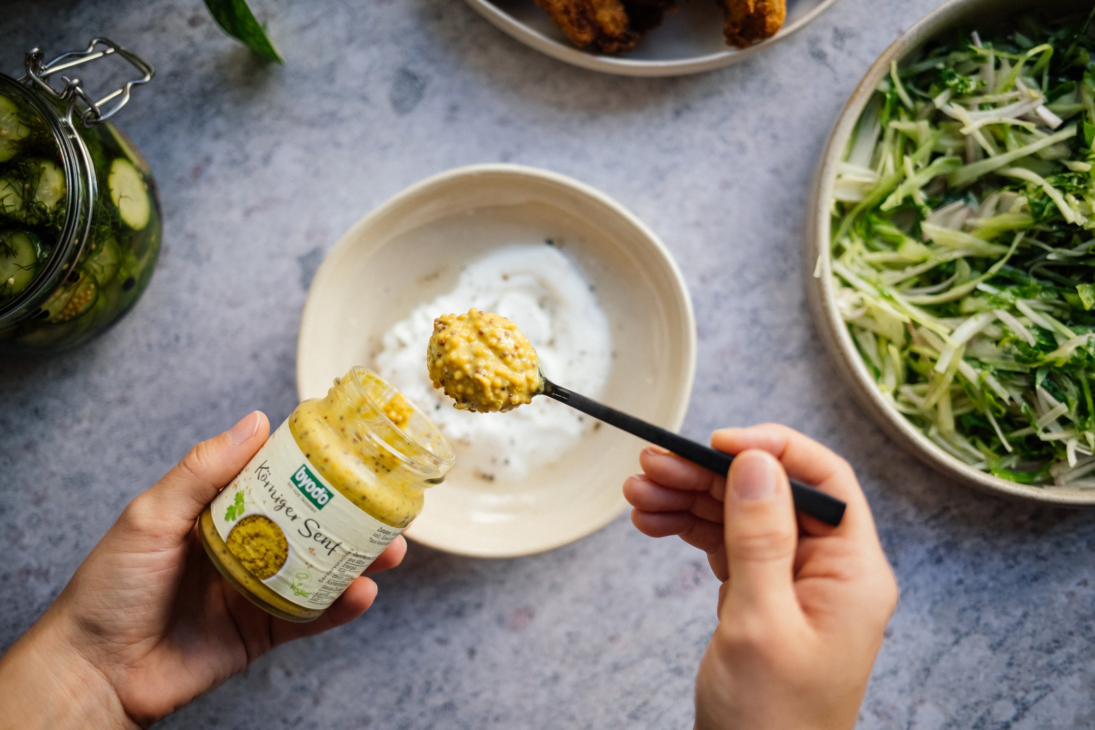 mixing burger sauce with vegan mayonnaise and grainy mustard