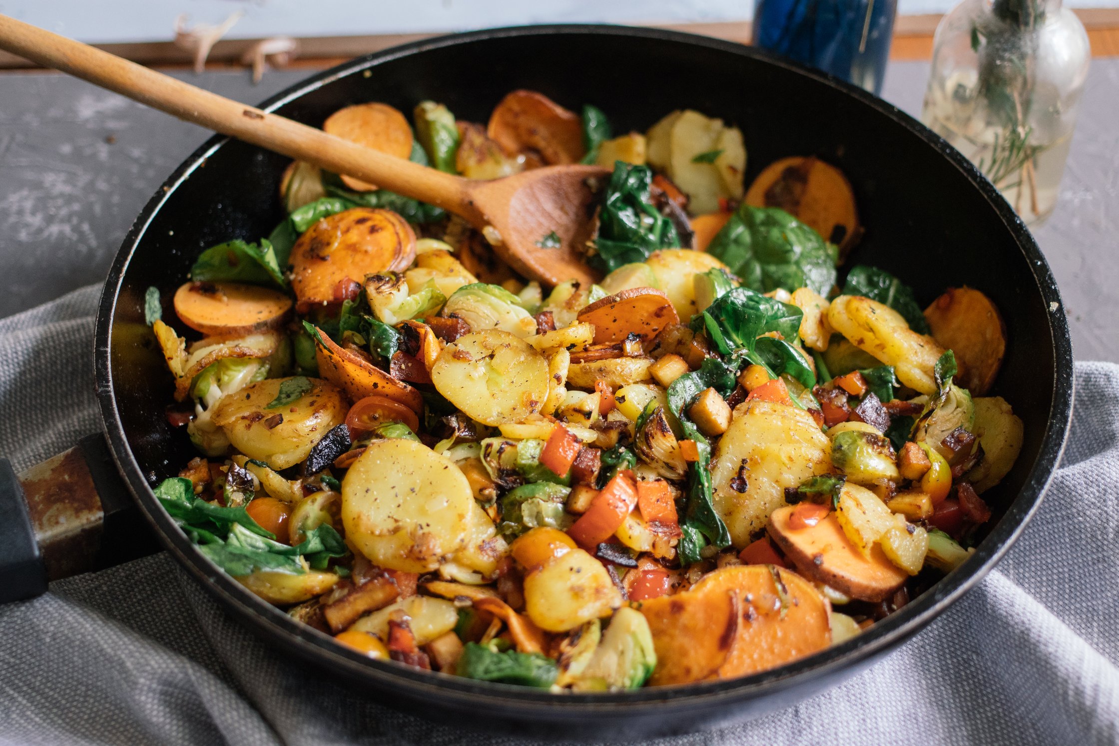 Vegan Pan fried Potatoes with Vegetables on the table