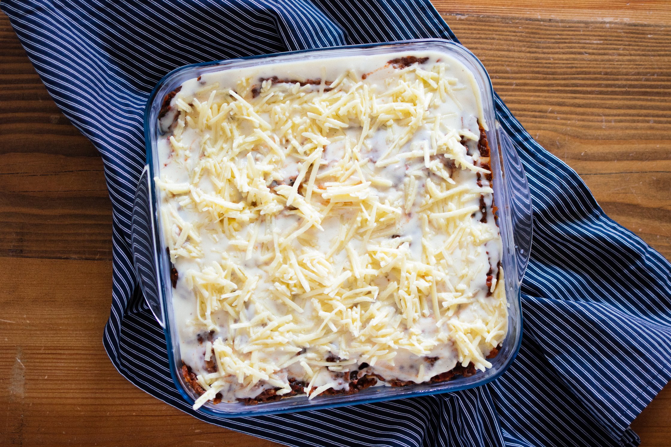 vegan lasagna with cheese before baking