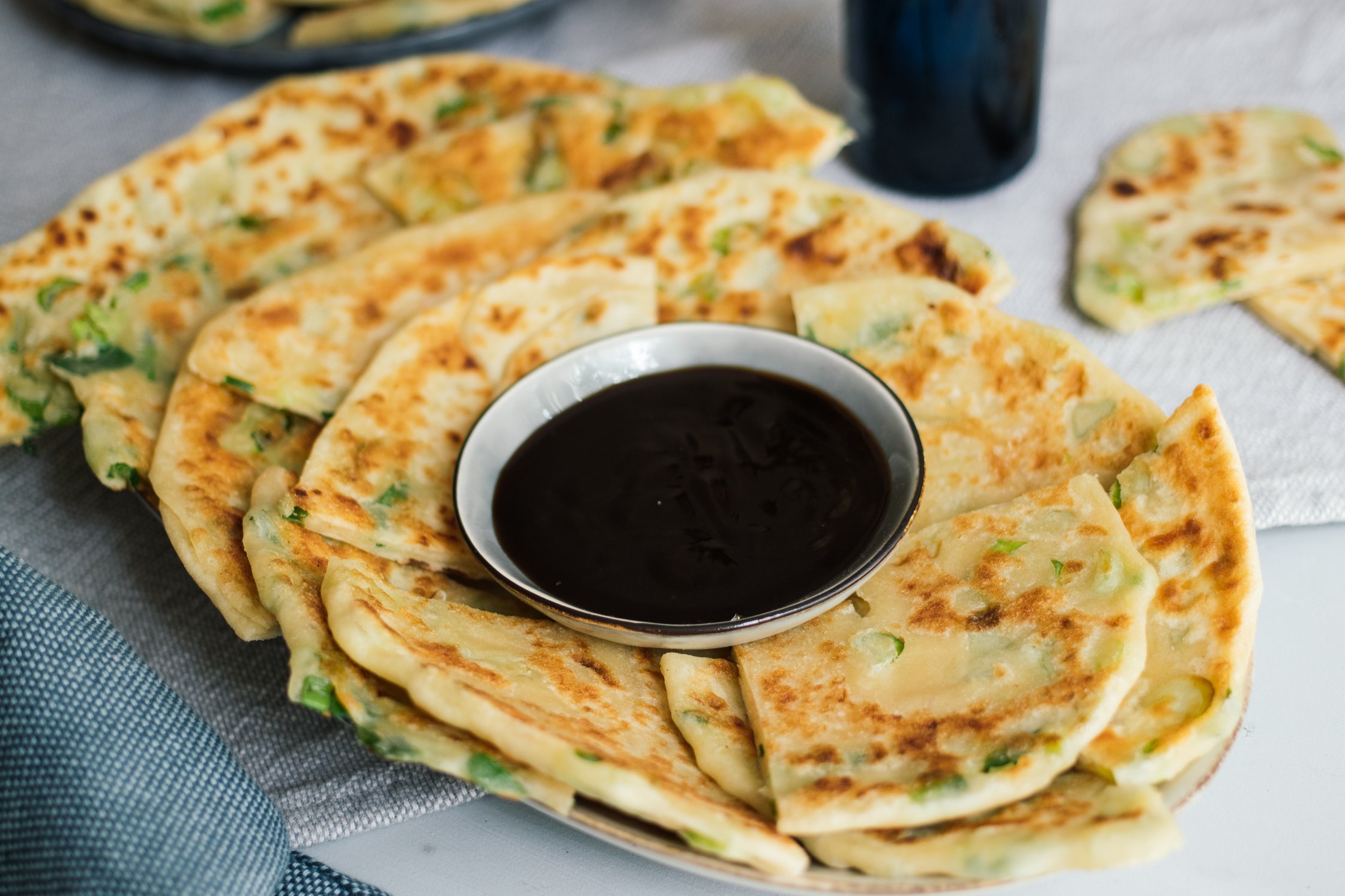 Vegan Scallion Pancakes on a plate with hoisin dip