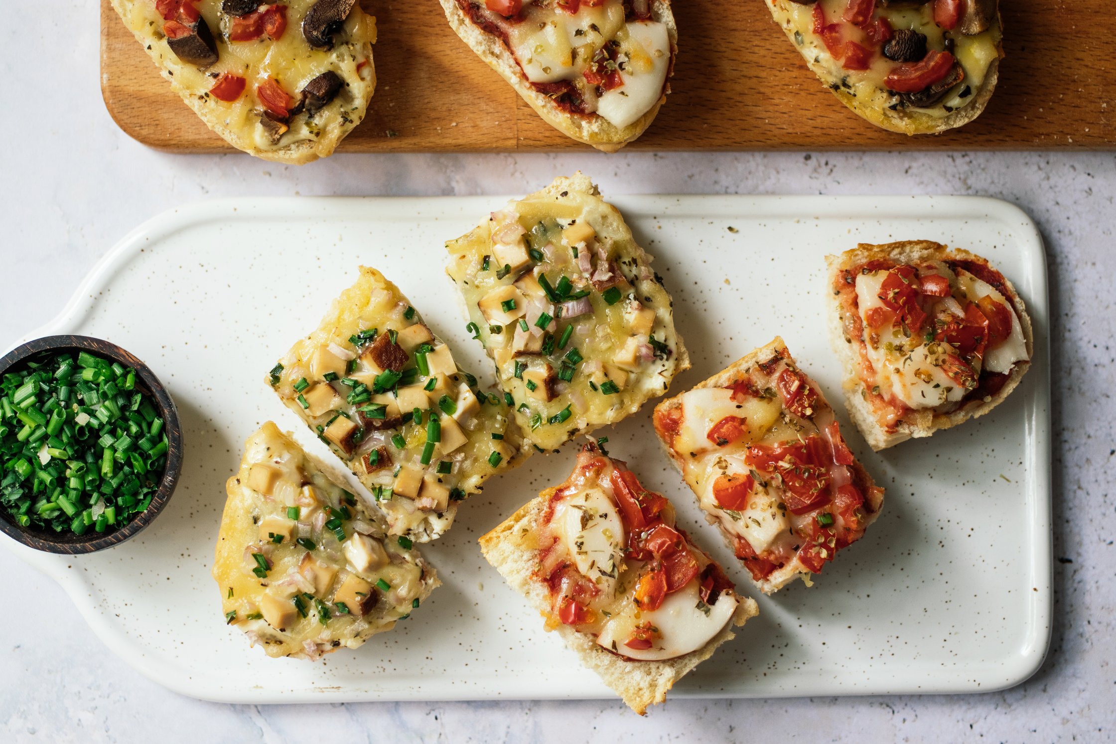 vegan french bread pizza cut into smaller pieces