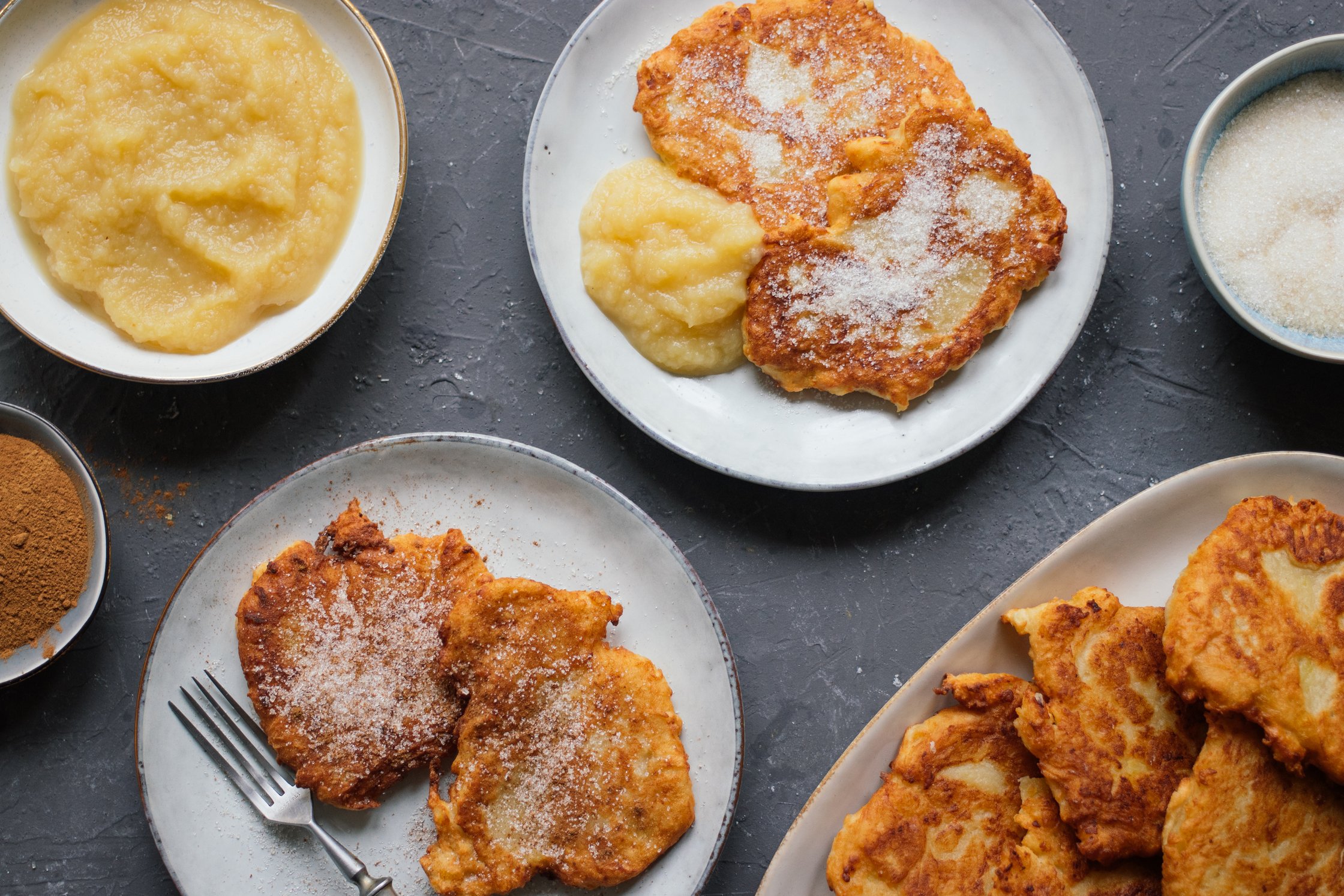 two servings Vegan Sweet Potato Pancakes sprinkled with sugar