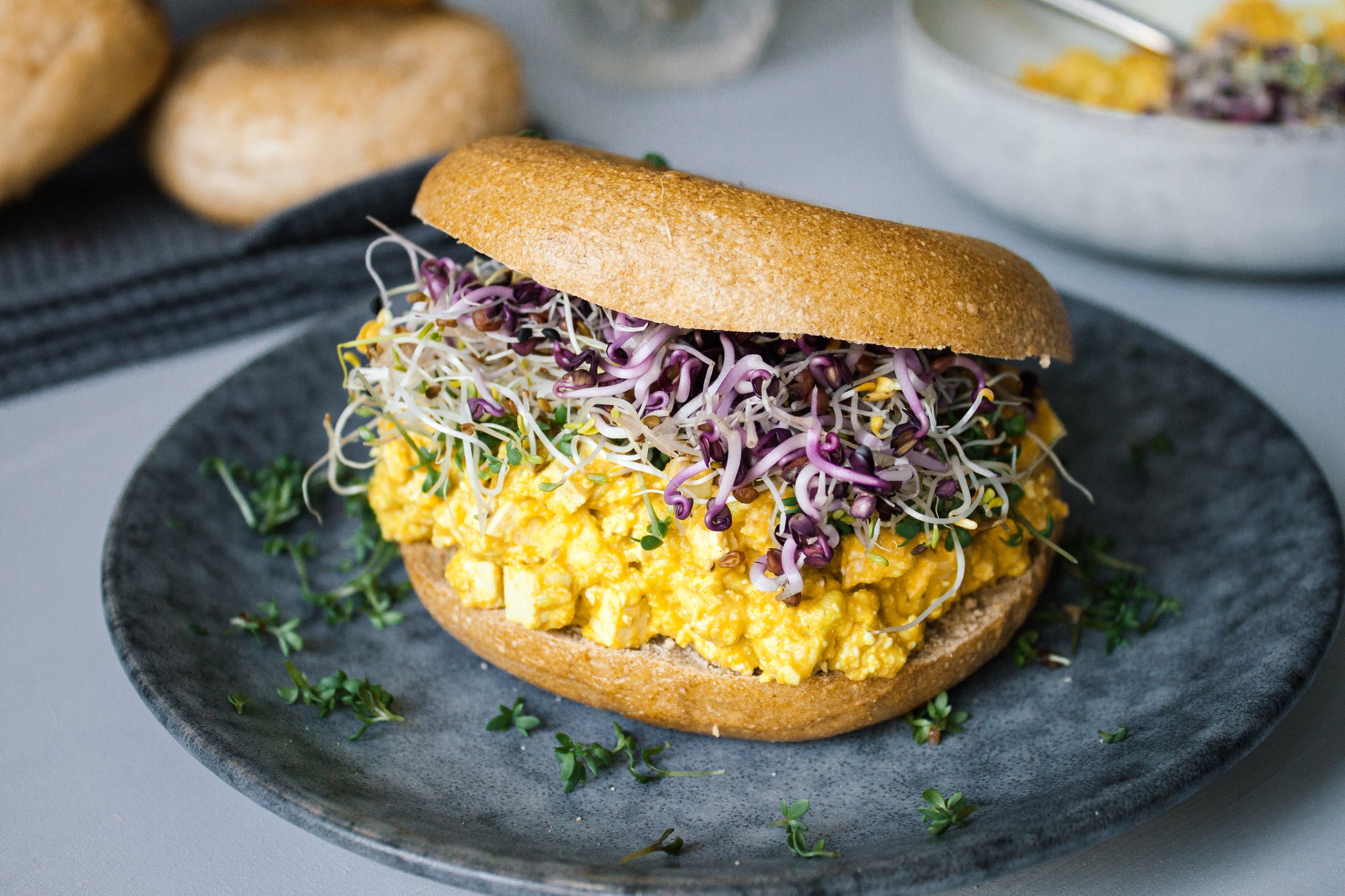 vegan breakfast bagel served on a plate
