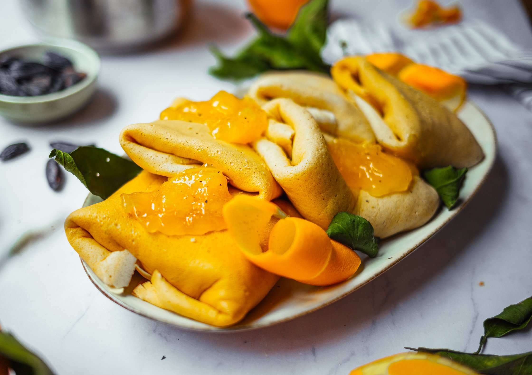 vegan crepes with orange jam on a big platter