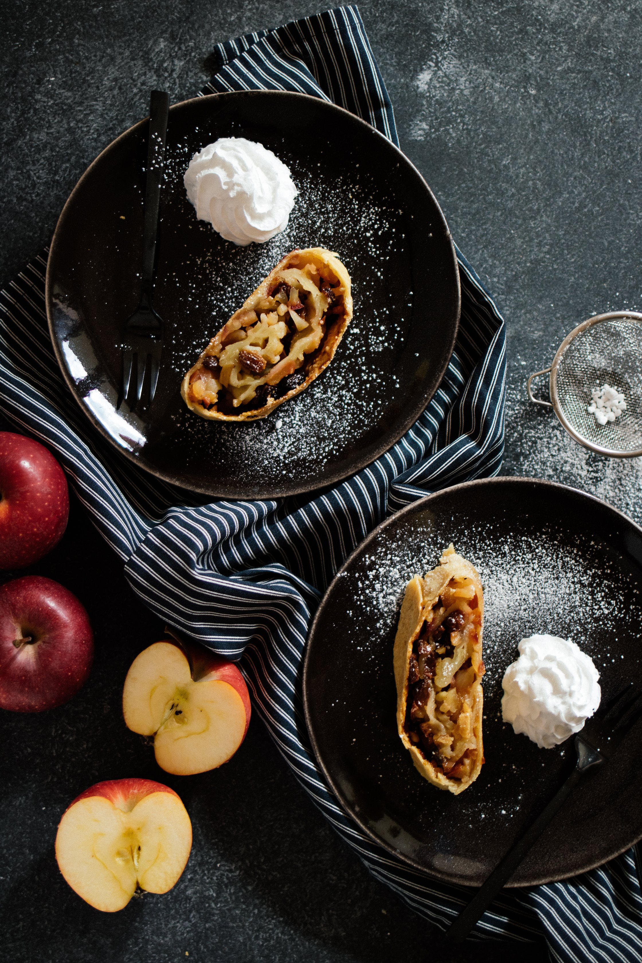 vegan apple strudel on a black backdrop