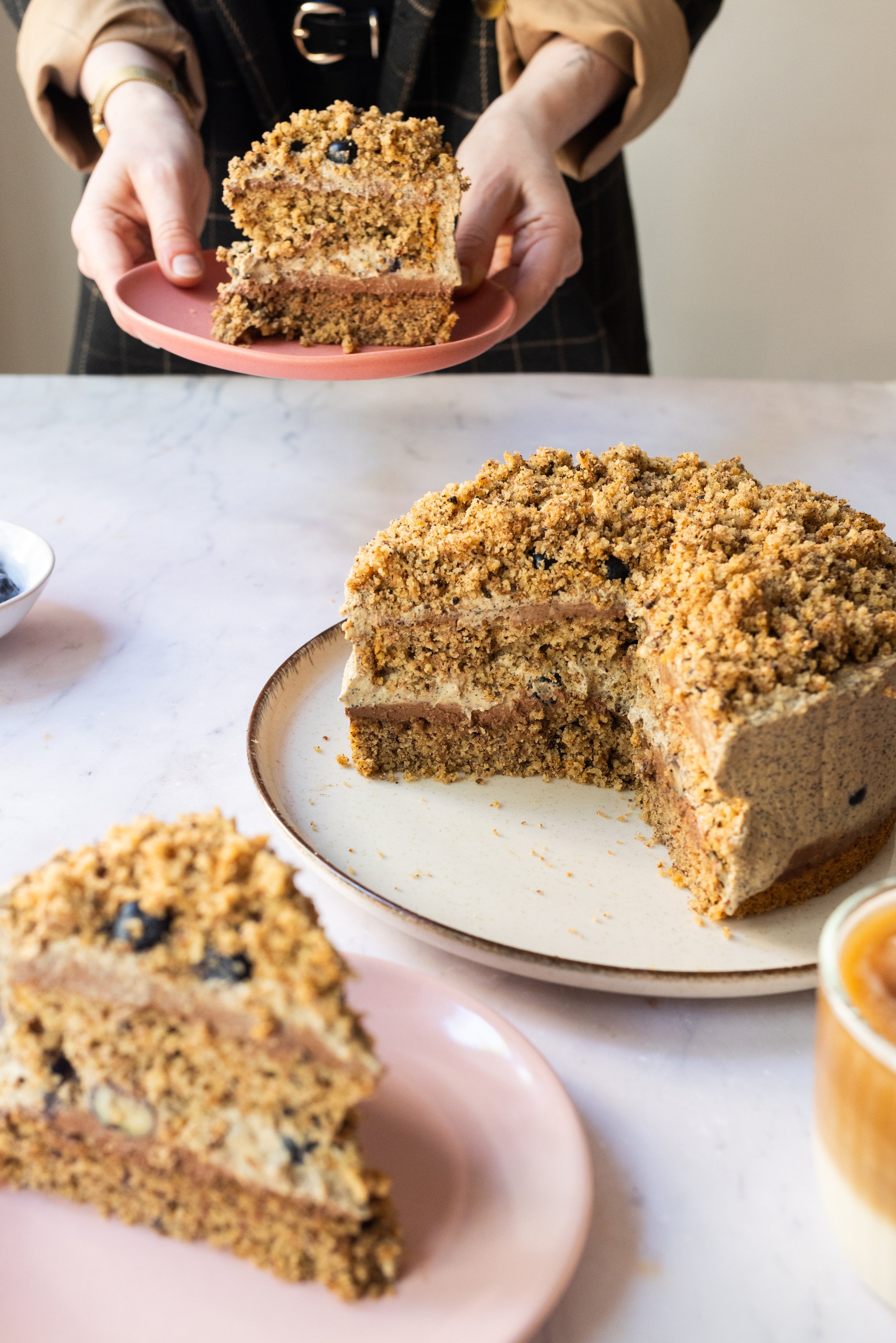 the cake is cut and one piece is served on a plate