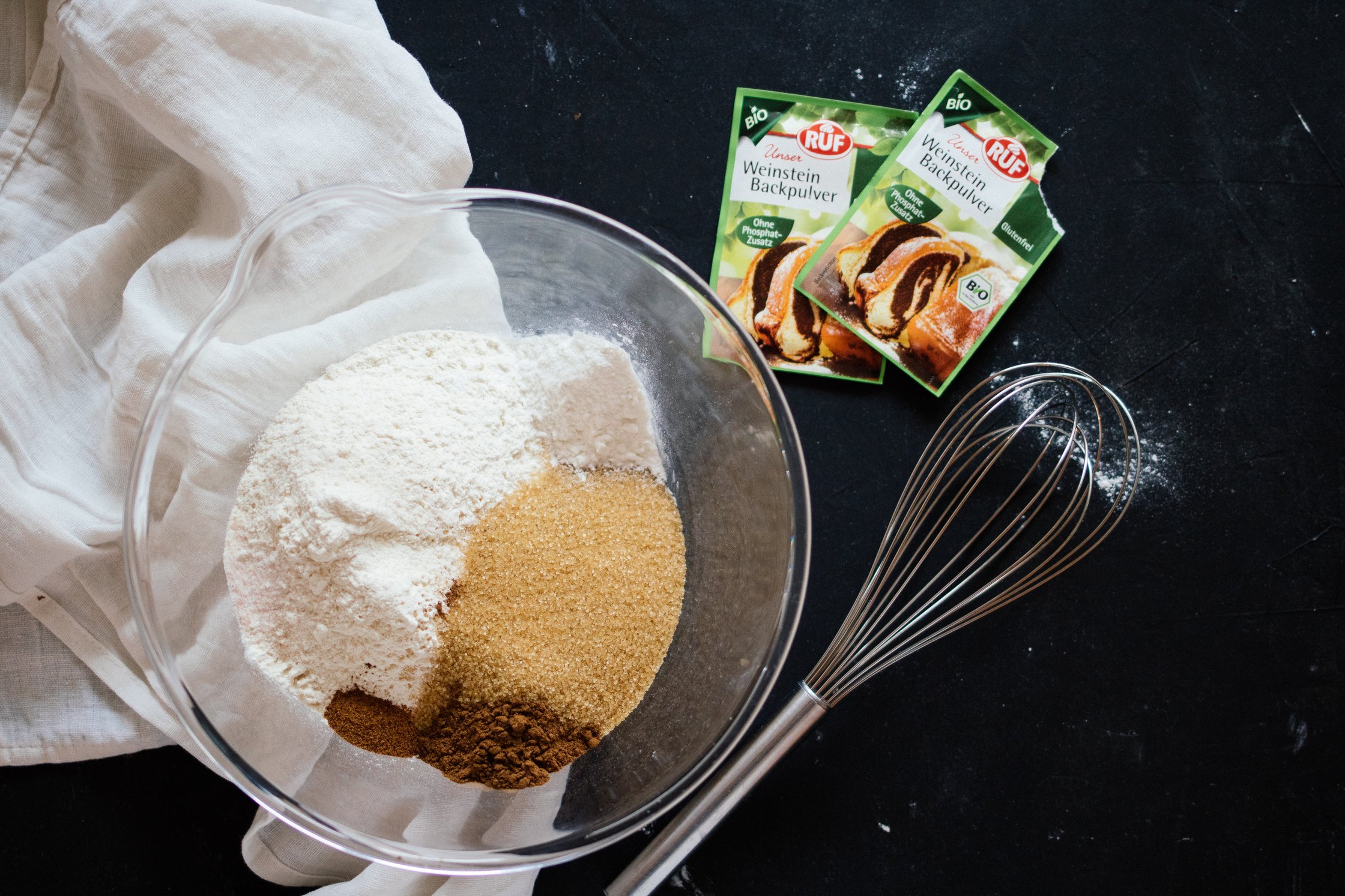 all ingredients for the cake in a glass bowl