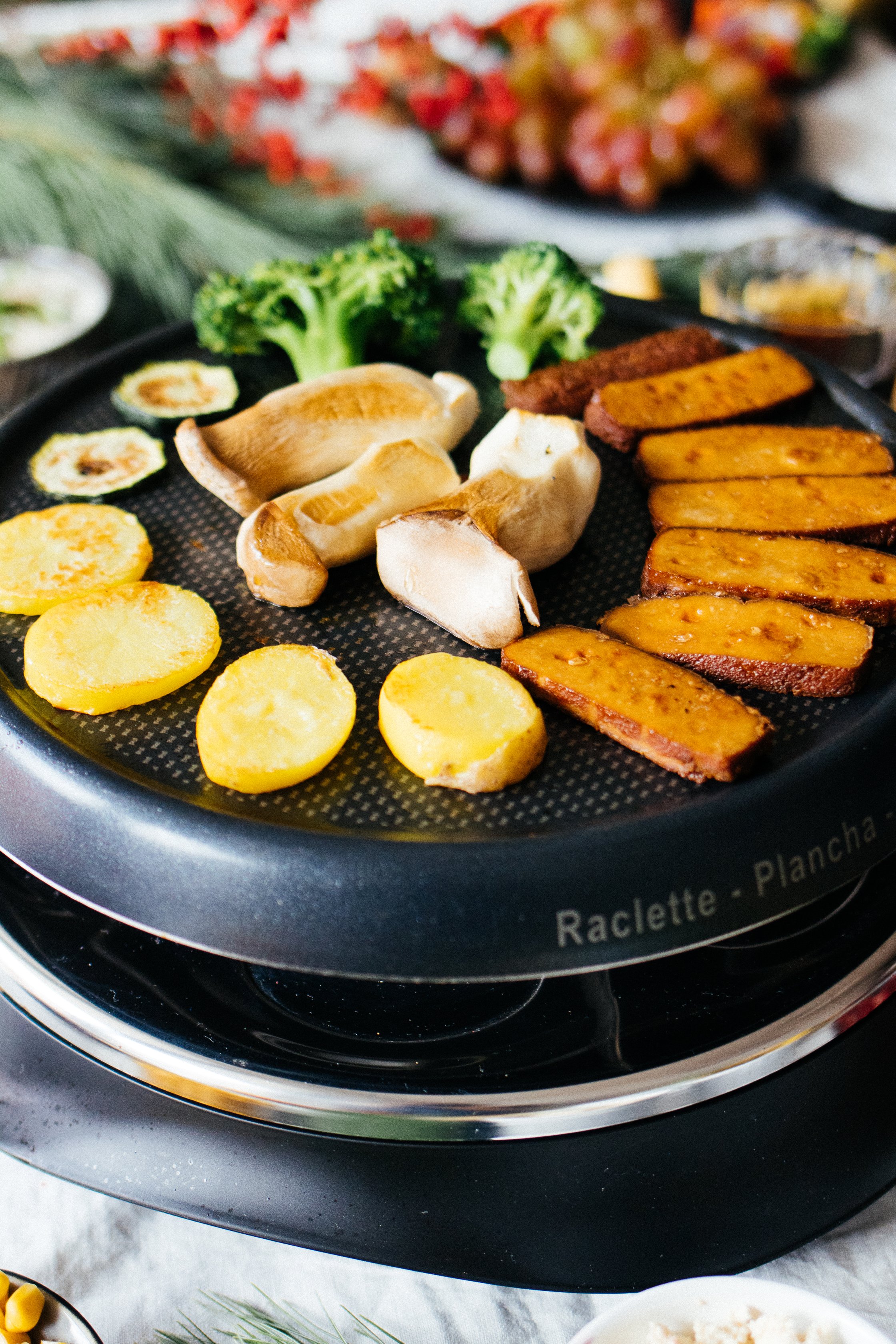 potatoes, tofu, and mushrooms on the raclette grill