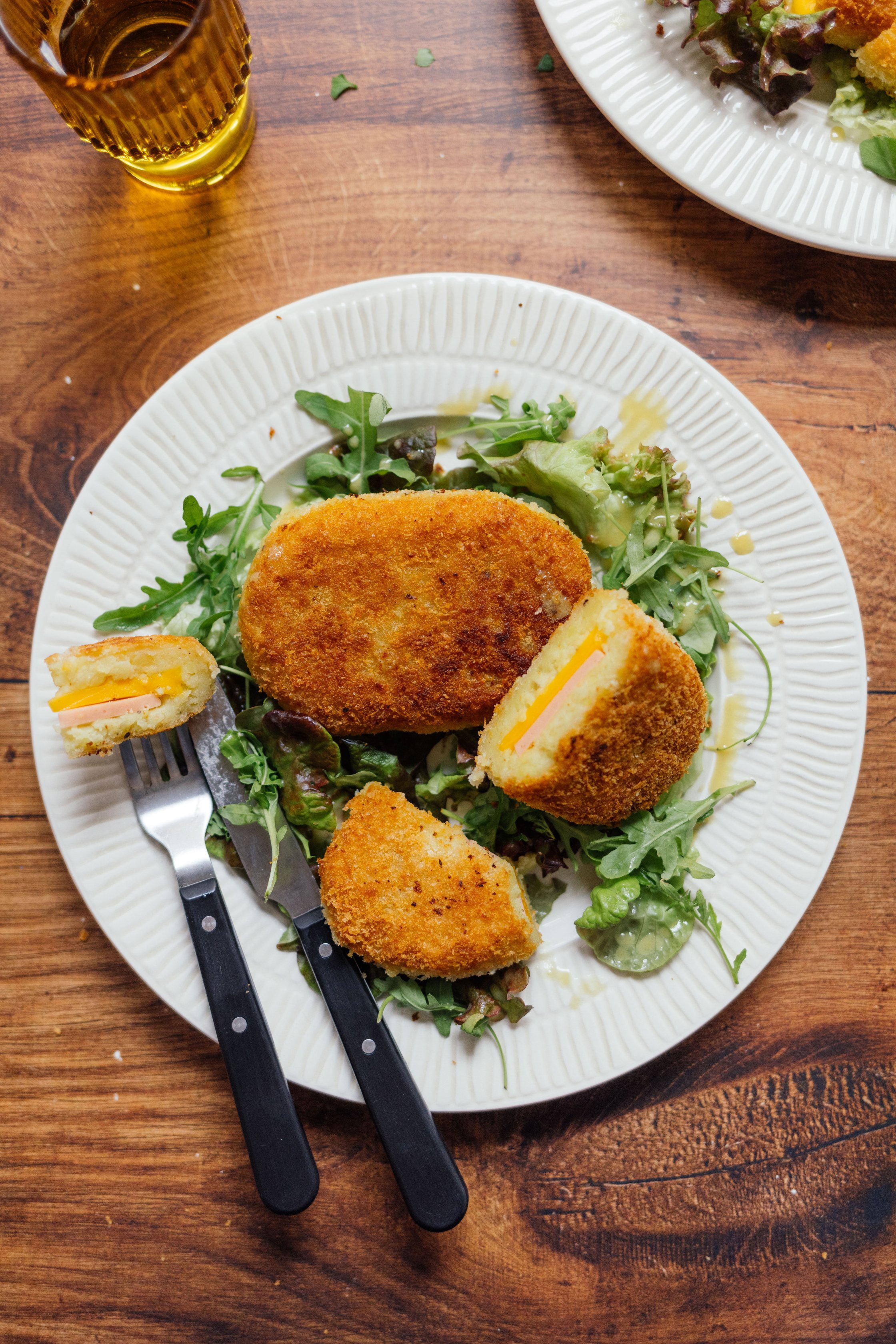 vegan dumpling cordon bleu served on salad