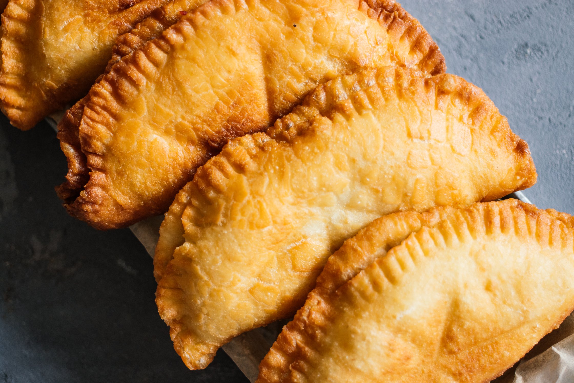 golden brown vegan panzerotti after deep frying