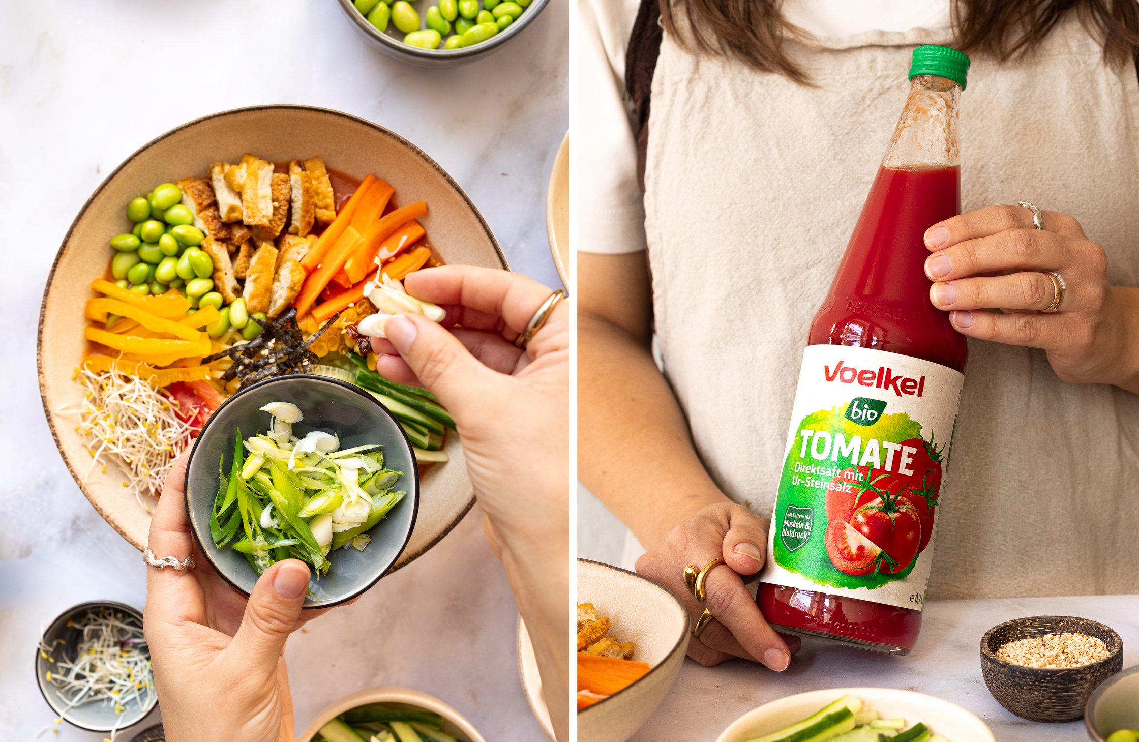 A bowl of fresh vegetables is topped with sliced leeks and accompanied by a bottle of Voelkl tomato juice.