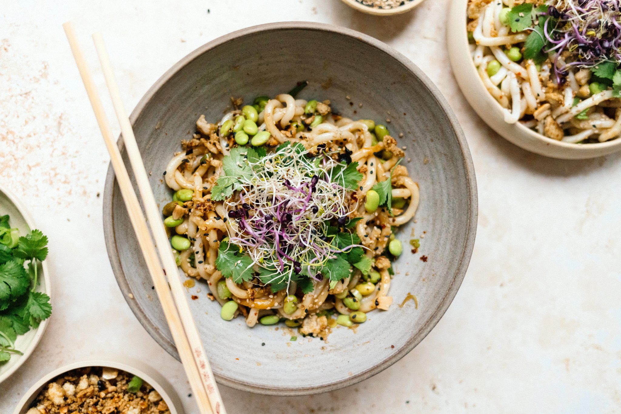 Hot Oil Udon Noodles with Crispy Crumbled Tofu on a plate