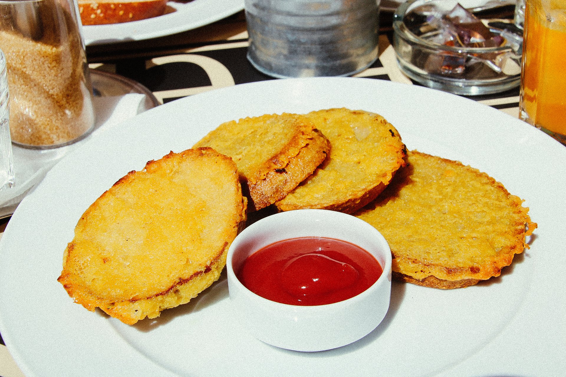 fried toast bread in egg and served with ketchup