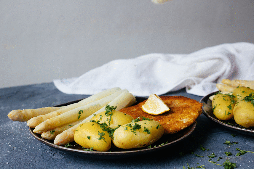 pouring vegan sauce hollandaise over the dish