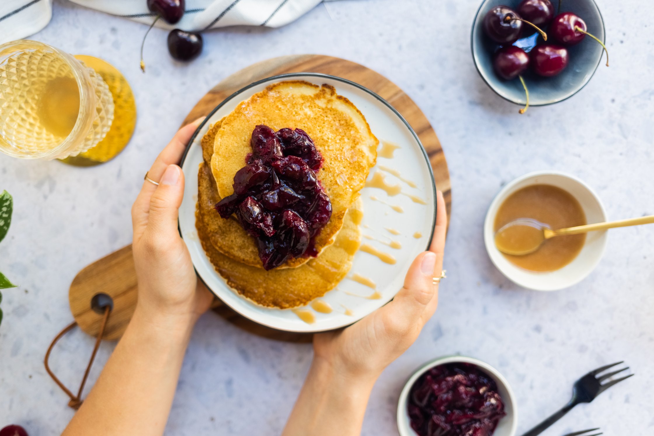 Vegan buttermilk blintzes with cherry compote with salted caramel sauce