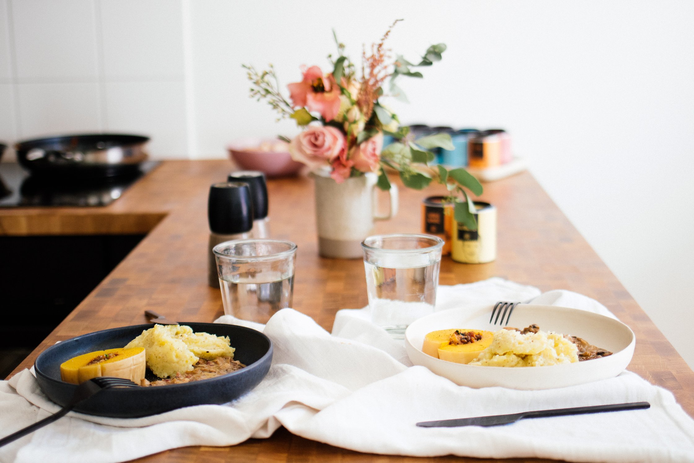 serving the stuffed vegan butternut squash