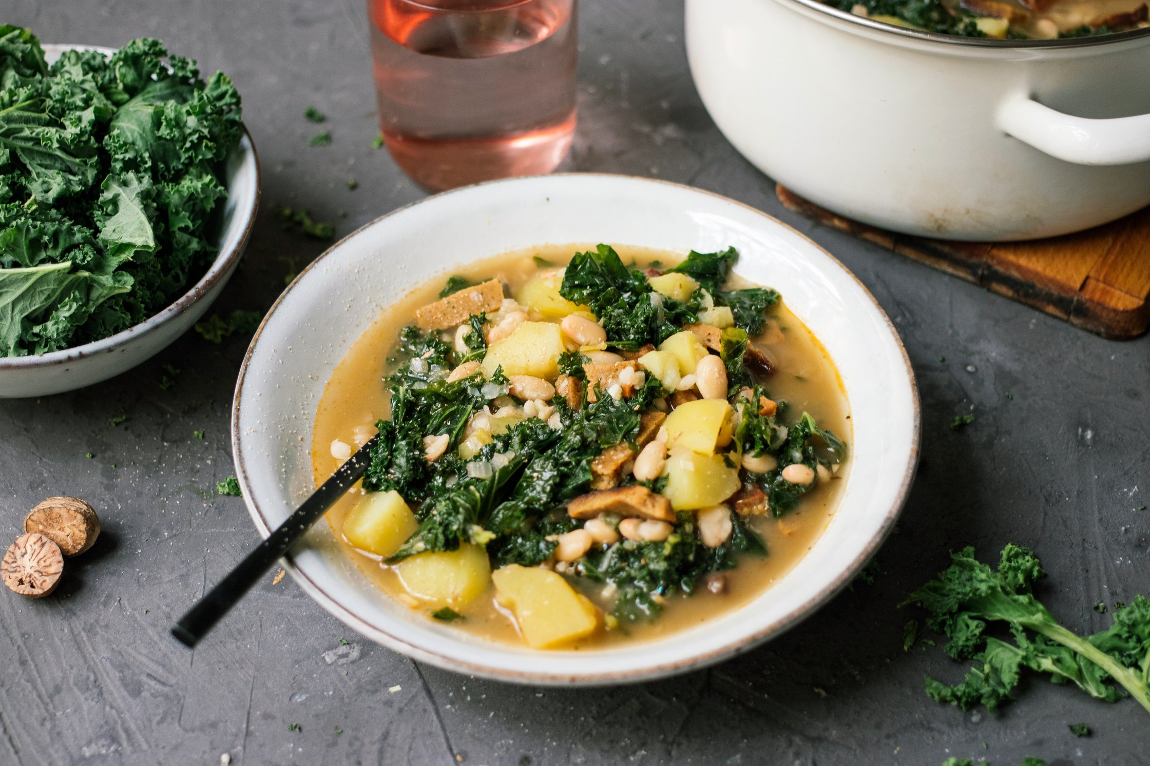 a deep plate full of vegan kale stew