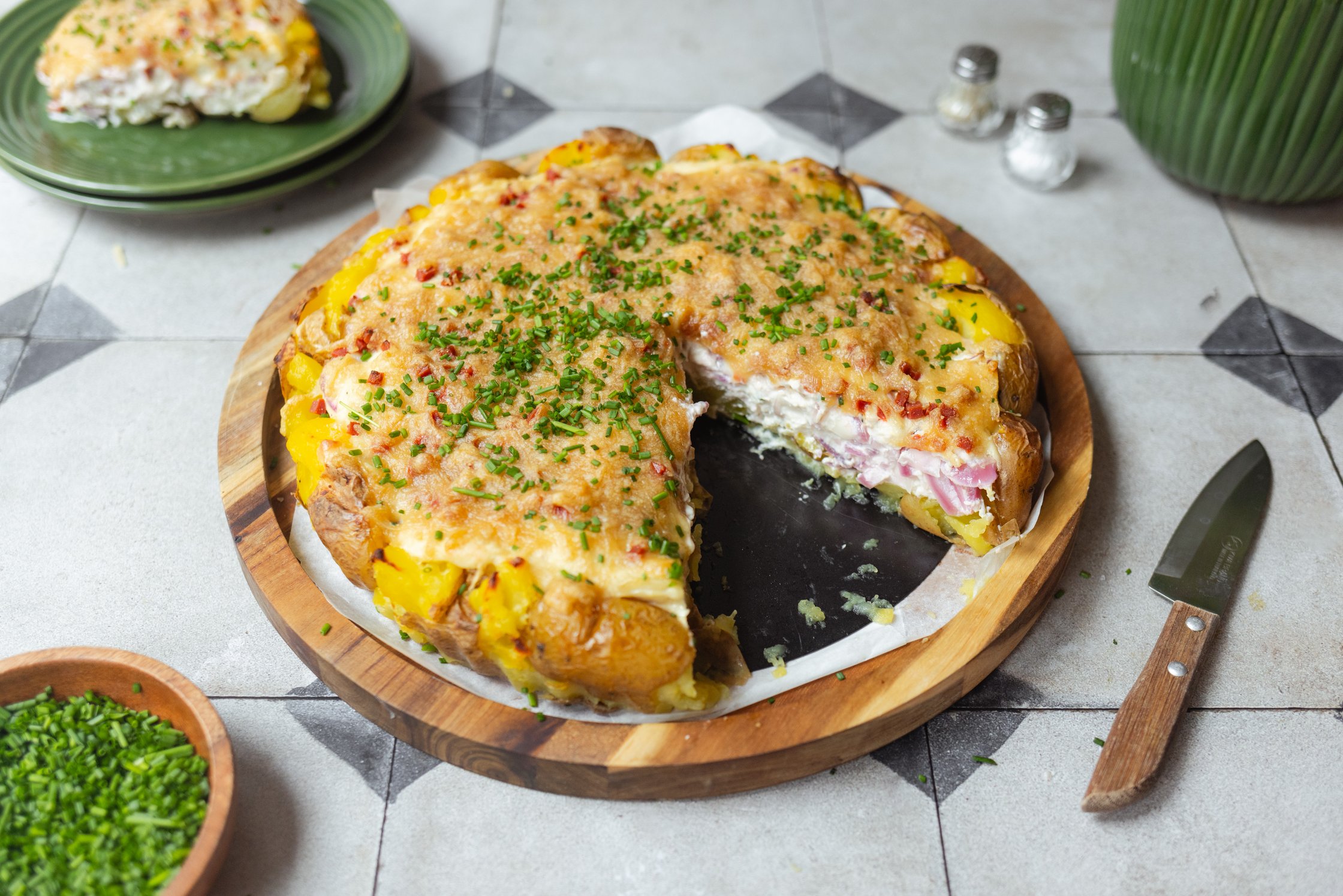smashed potato onion tarte on a wooden board