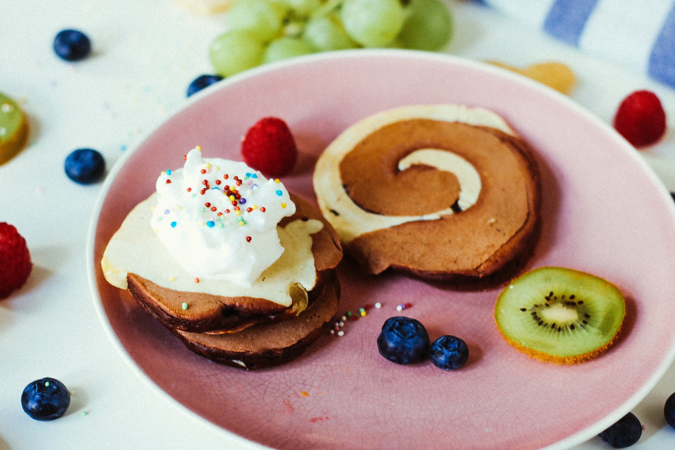 2 vegan magic pancakes decorated with berries