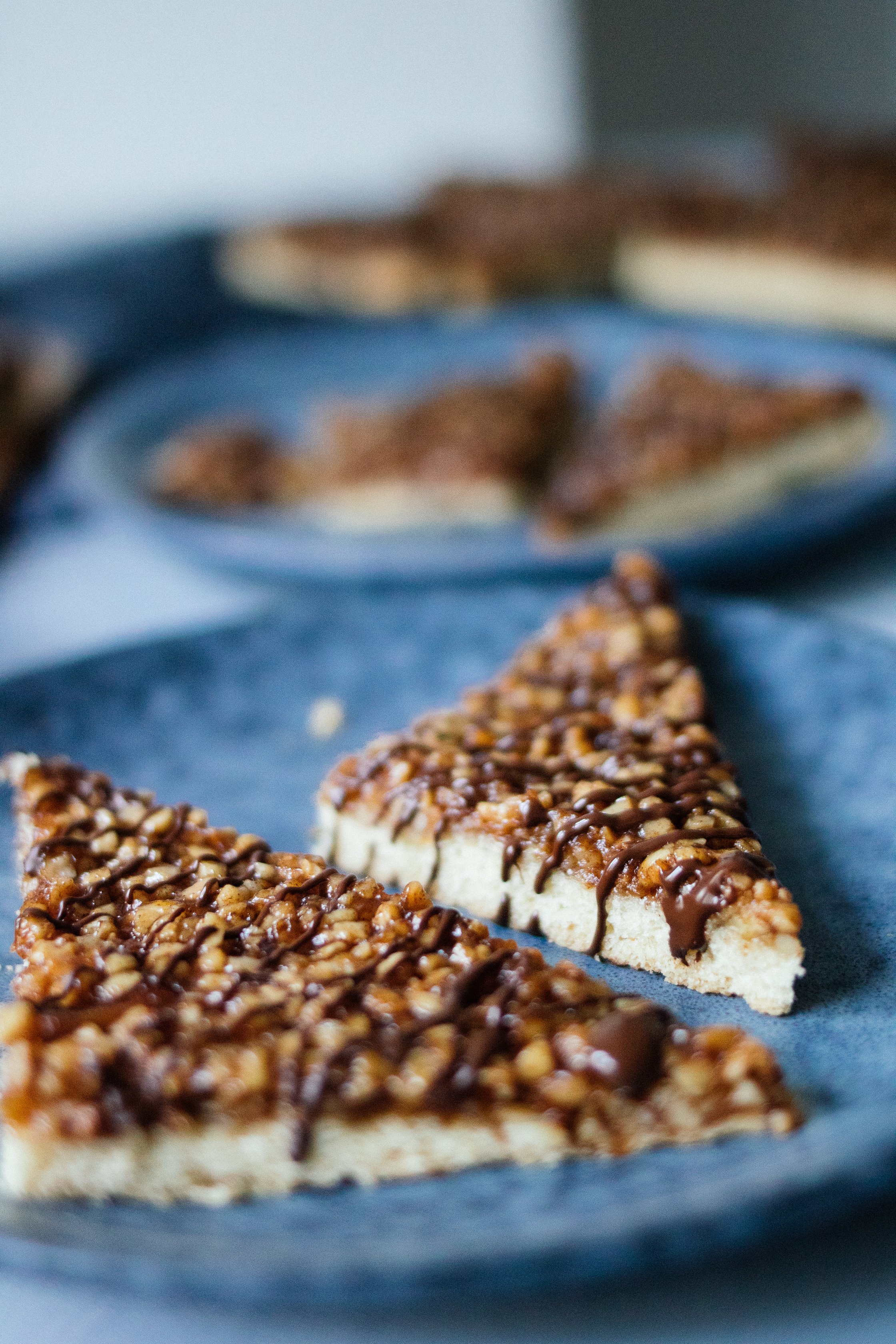Vegan nut triangles on a blue plate