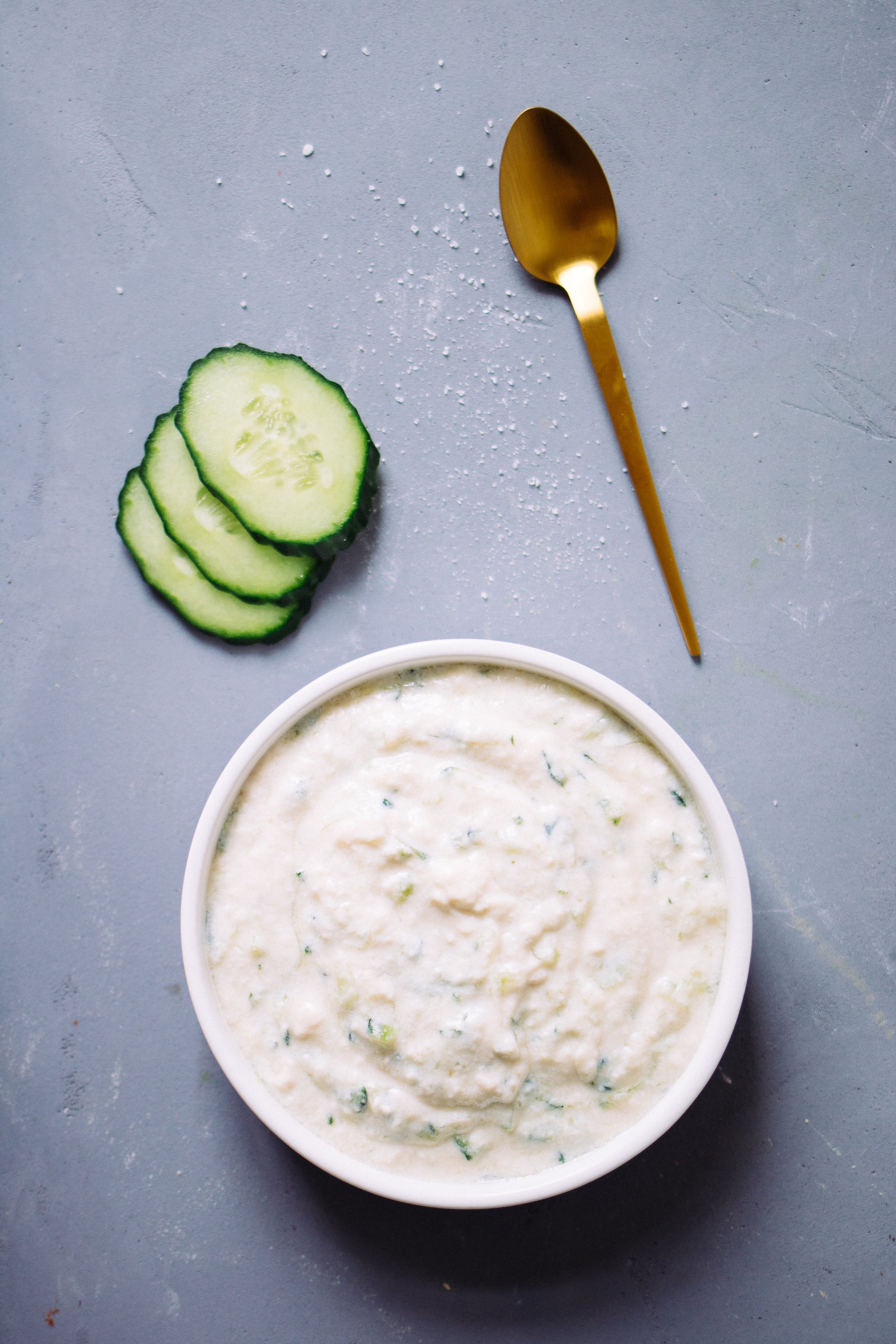 Tzatziki next to cucumber slices