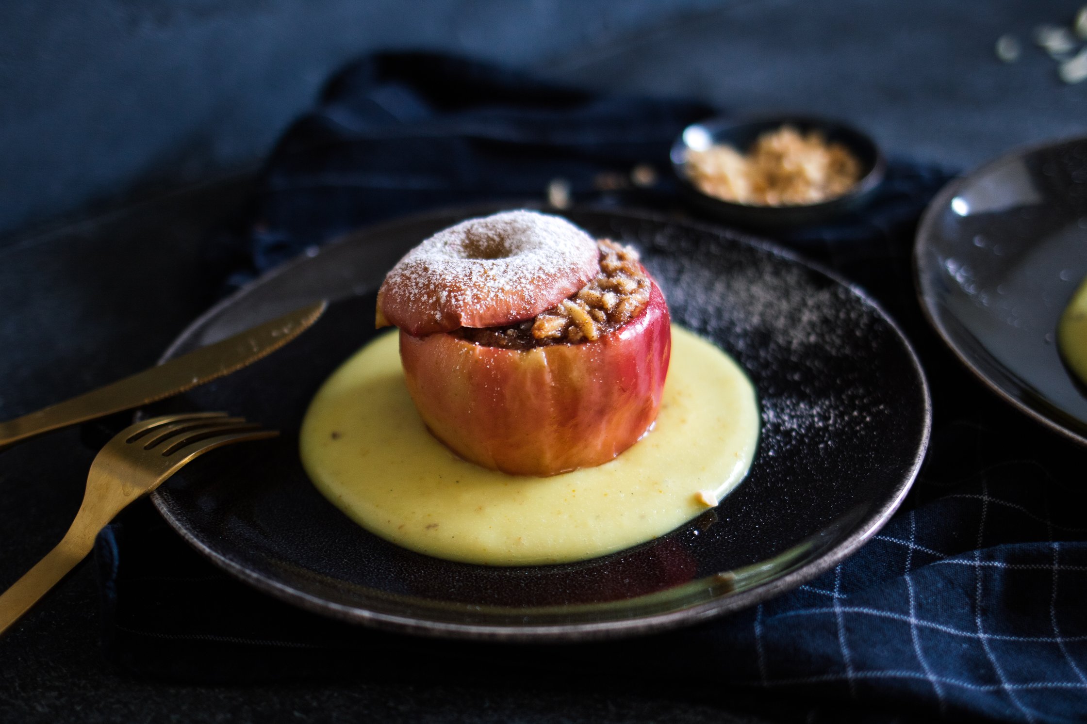 vegan baked apple with warm vanilla sauce