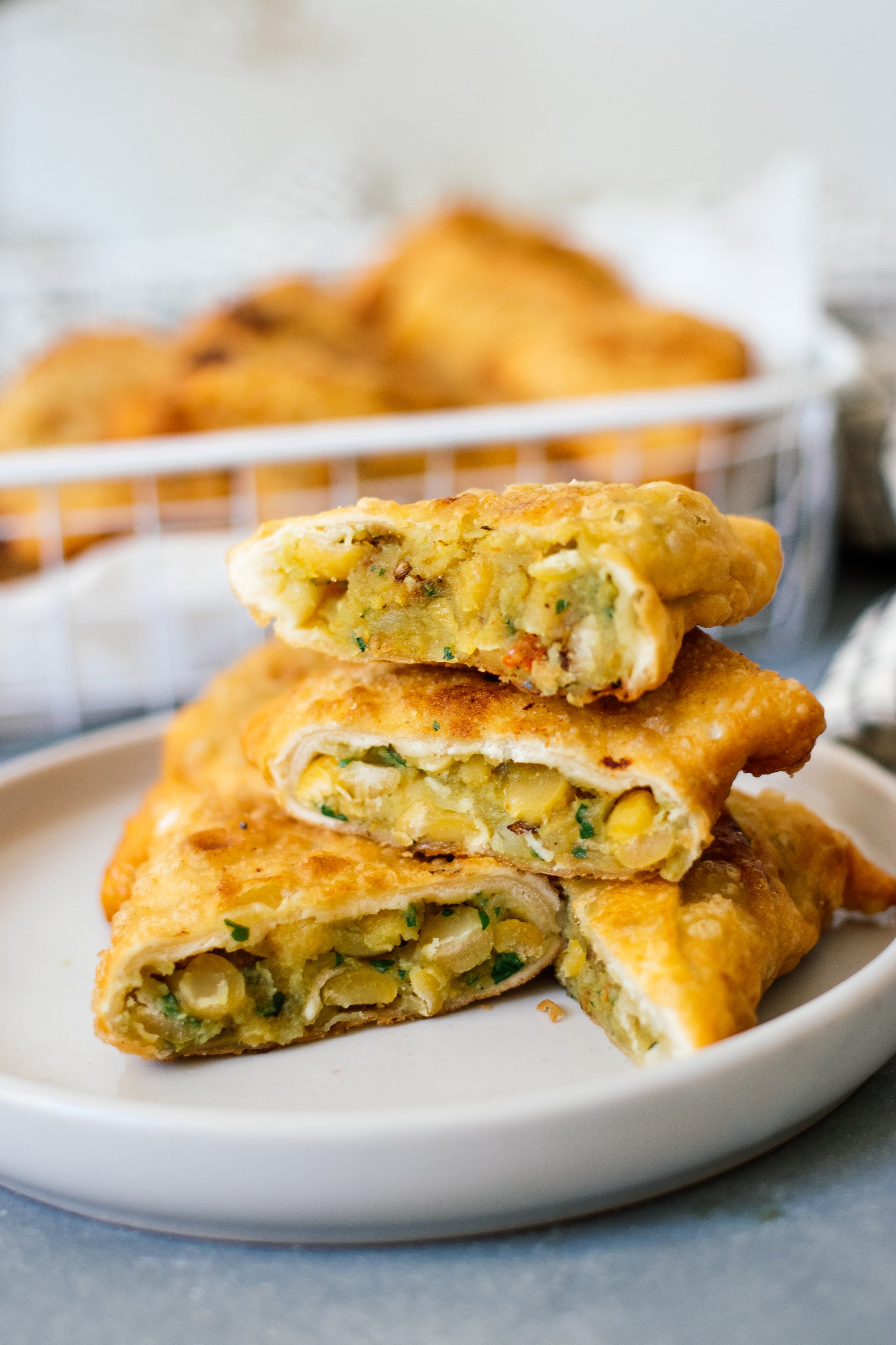 vegan samosas cut open on a plate