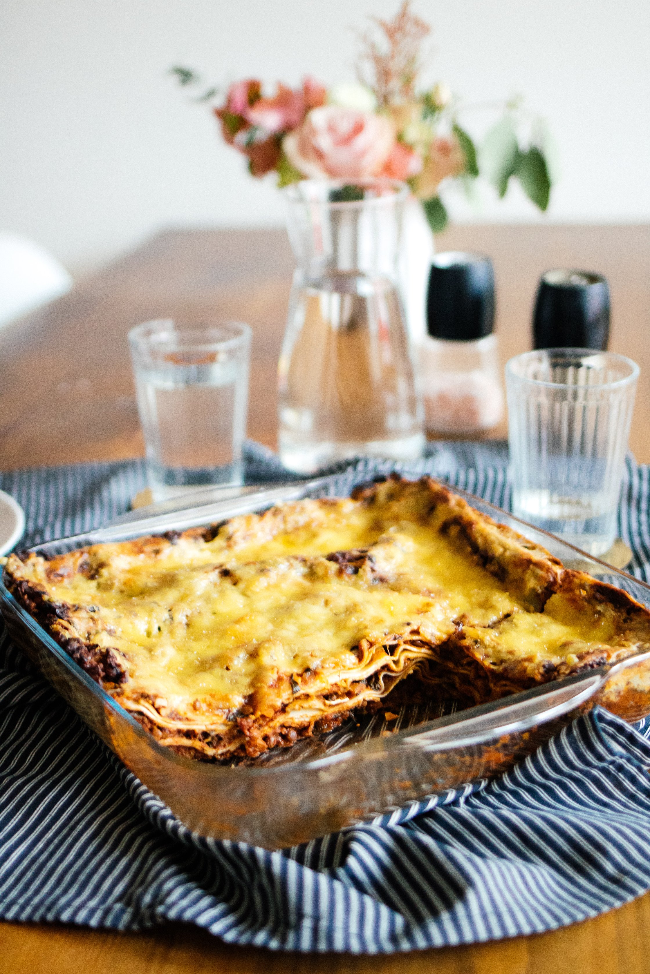 vegan lasagna with lentils and spinach in a casserole dish