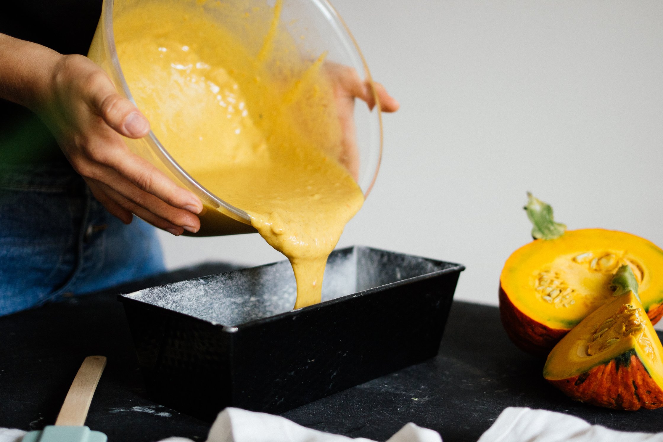 filling the cake dough into a baking tin