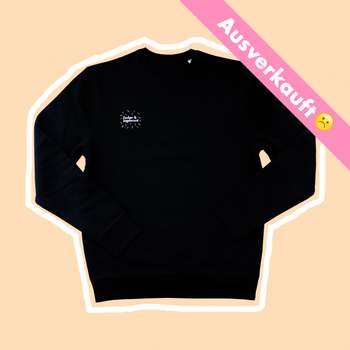 Schwarzer Sweater mit Streuseln