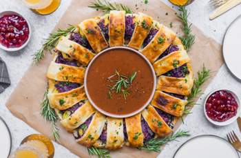 Vegan Puff Pastry Wreath Filled with Potato Dumplings, Red Cabbage & Plant-Based Sausages